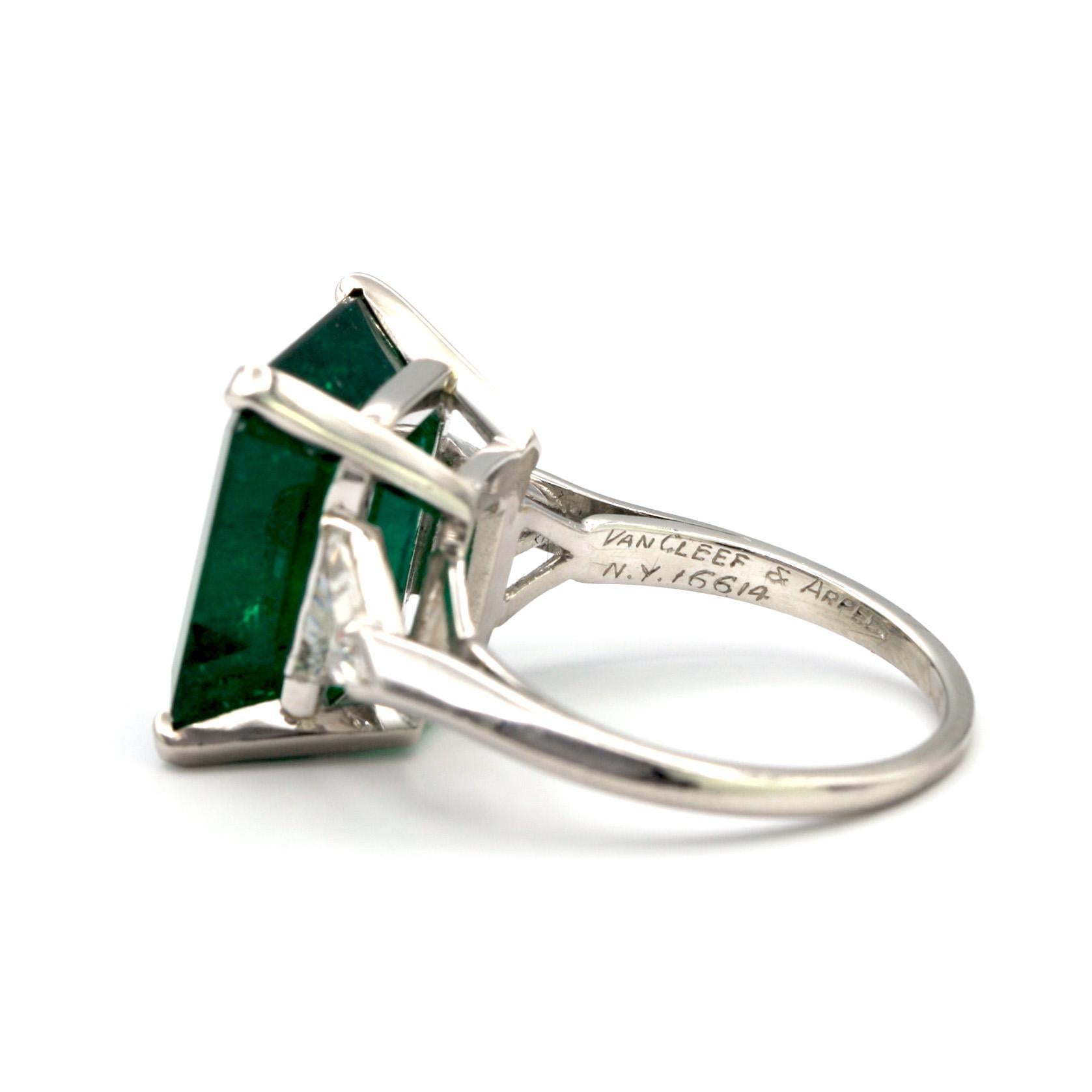 Van Cleef & Arpels 9.85 carat Colombian Emerald Ring with two side triangle White diamonds approx .05ct each. 
Mounted in Platinum

Stamped 