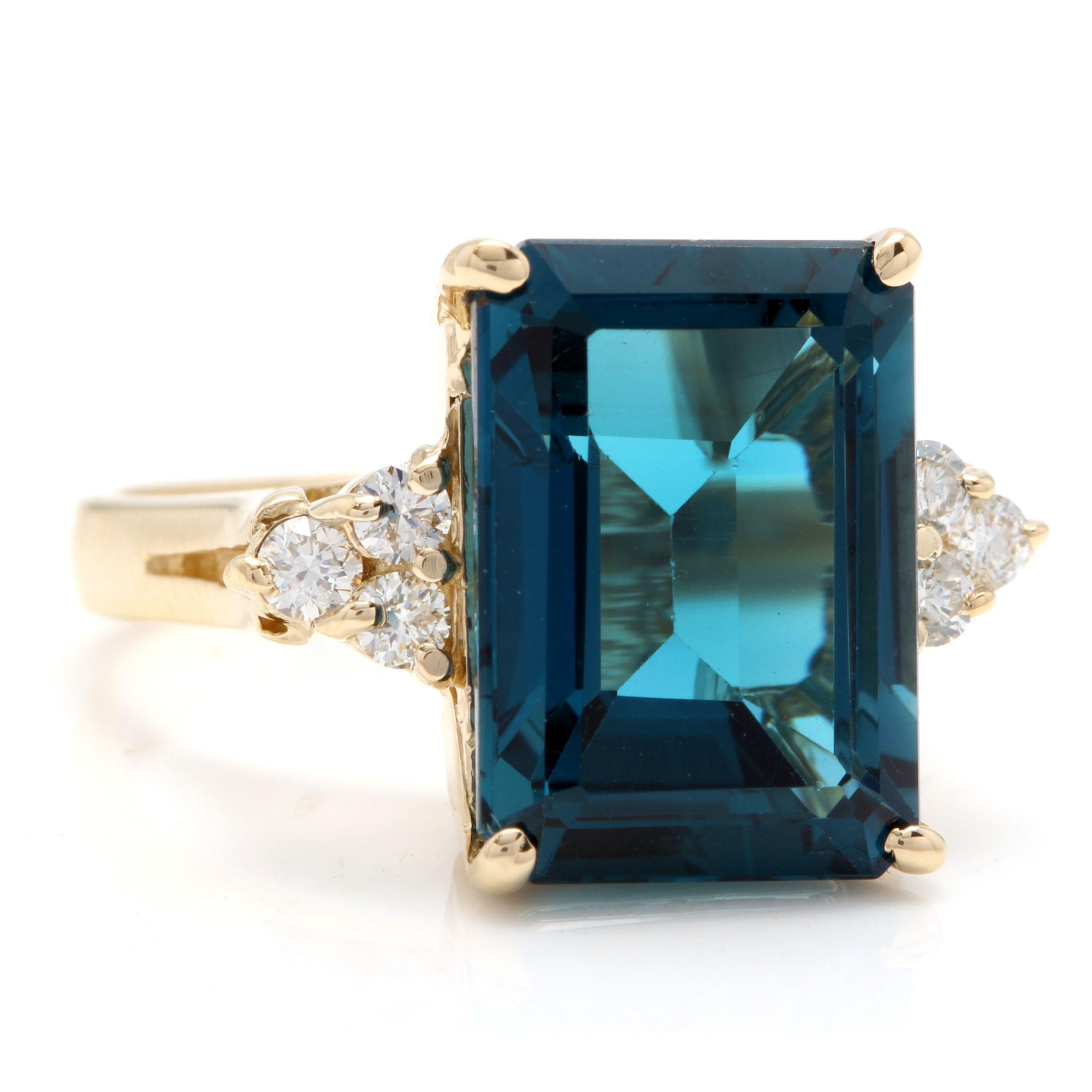 9.85 Carats Natural Impressive London Blue Topaz and Diamond 14K Yellow Gold Ring

Total Natural London Blue Topaz Weight: 9.50 Carats (VVS)

London Blue Topaz Measures: 14 x 10mm

Natural Round Diamonds Weight: .35 Carats (color G-H / Clarity