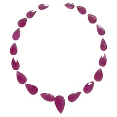 98.64 carats ruby Mozambique cut stone pear 19 Pieces layout heated natural gem