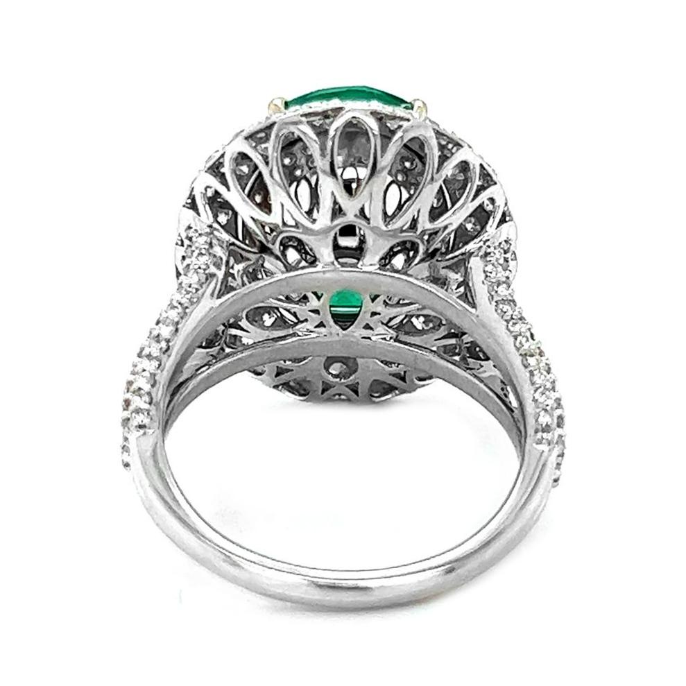 Oval Cut 9.87 T.W Natural Mined Oval Emerald Diamond Halo 18KT White Gold Cocktail Ring  For Sale