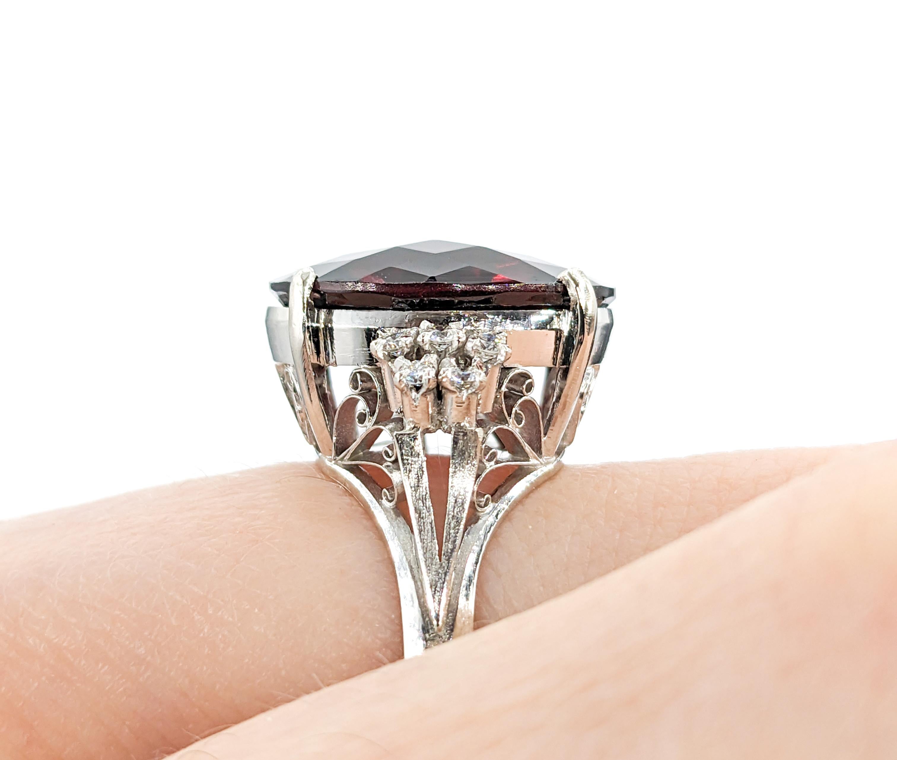 9.88ct Garnet & Diamond Ring In 850pt Platinum

Introducing this exquisite Garnet Ring, elegantly crafted in 850pt Platinum and adorned with .20ctw of shimmering Diamonds. The center stone is a striking 16.5x12mm Garnet, with a deep red color. The