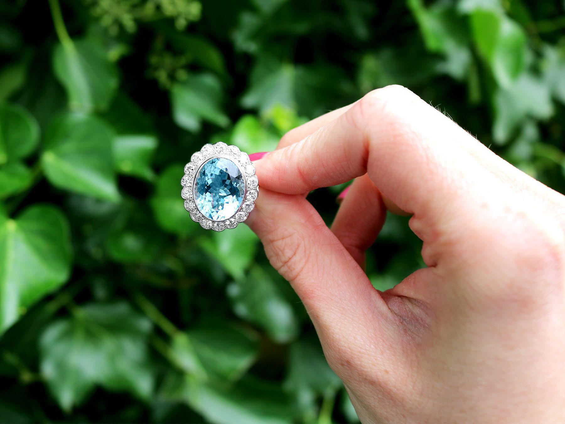 A stunning, fine and impressive 9.89 carat aquamarine and 2.70 carat diamond and platinum cluster ring; part of our diverse contemporary jewelry and estate jewelry collections.

This stunning contemporary aquamarine ring has been crafted in