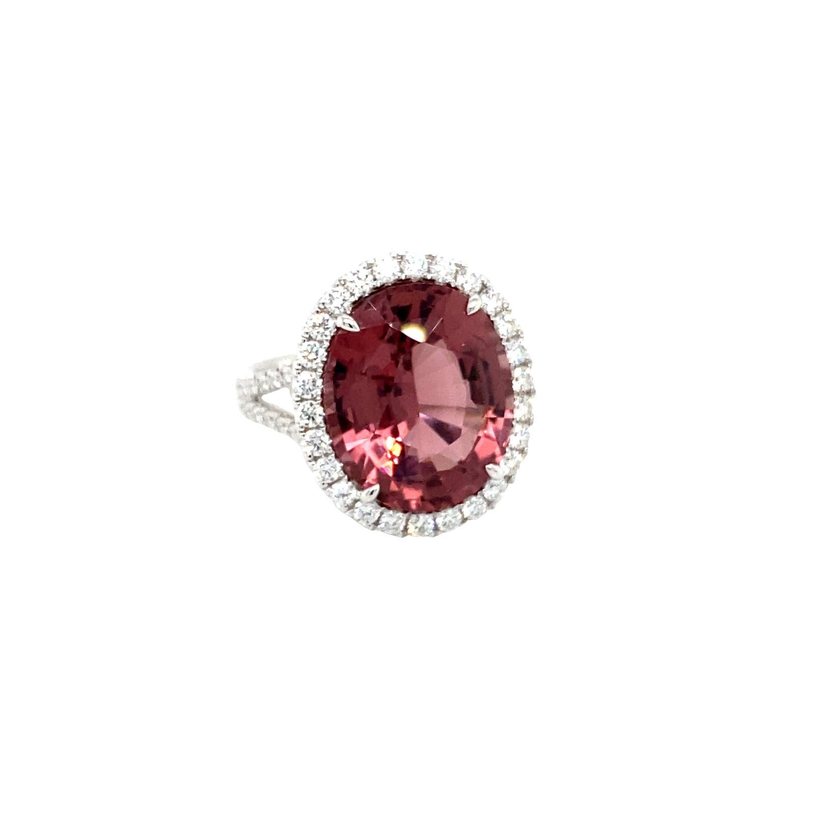GIA Certified Oval Pink Tourmaline weighing 9.89 carats
Measuring (15.88x13.16x7.87) mm
70 Pieces of round diamonds weighing .96 carats
Diamonds are GH-Si1
Set in 18 karat white gold ring
7.00 grams