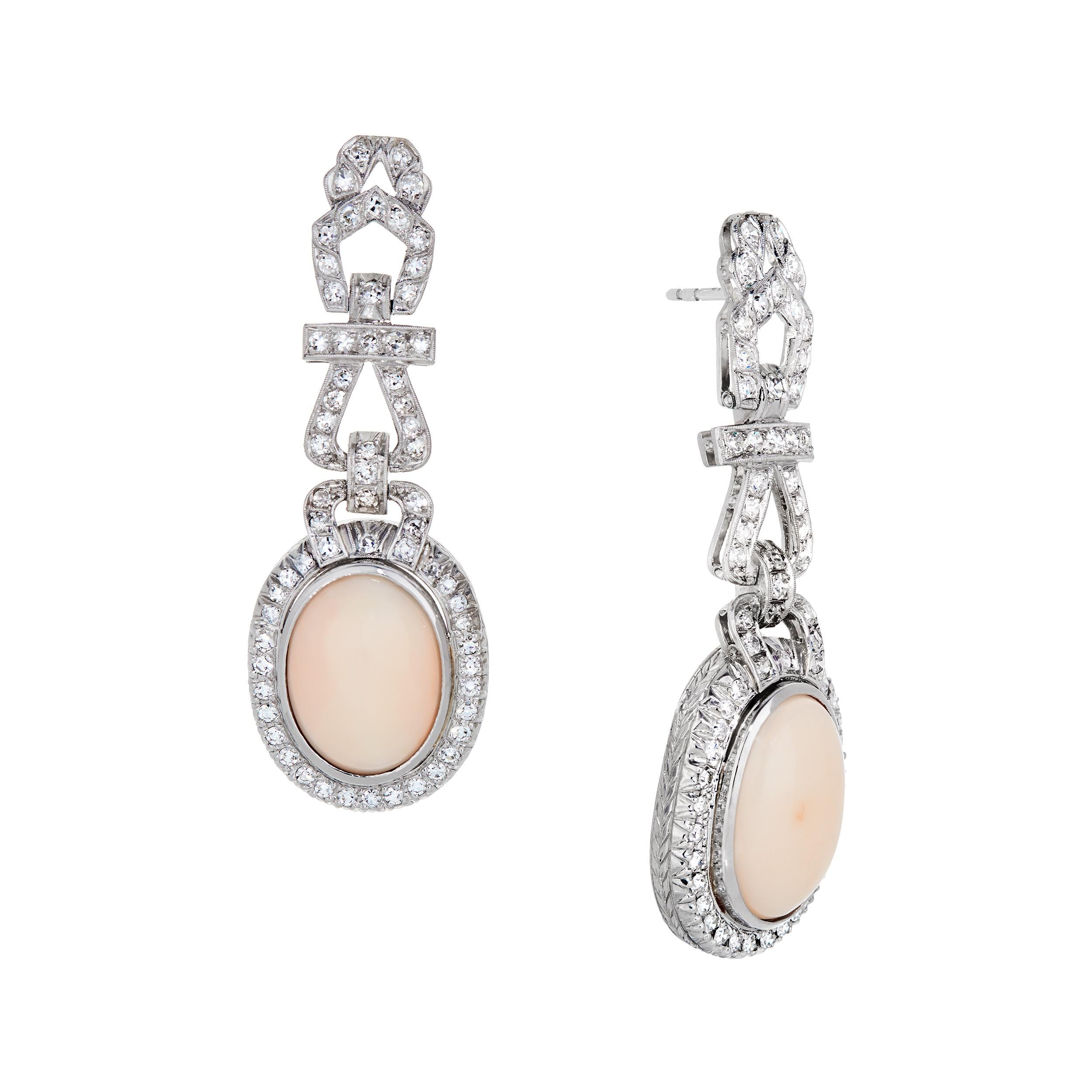 Vintage meets Vintage to create a new glorious life together!  Perfectly matched Oval Shaped Angel Skin Coral fit perfectly into this refurbished and redesigned vintage earring set in Platinum.

These Earrings coordinate perfectly with an Angel Skin