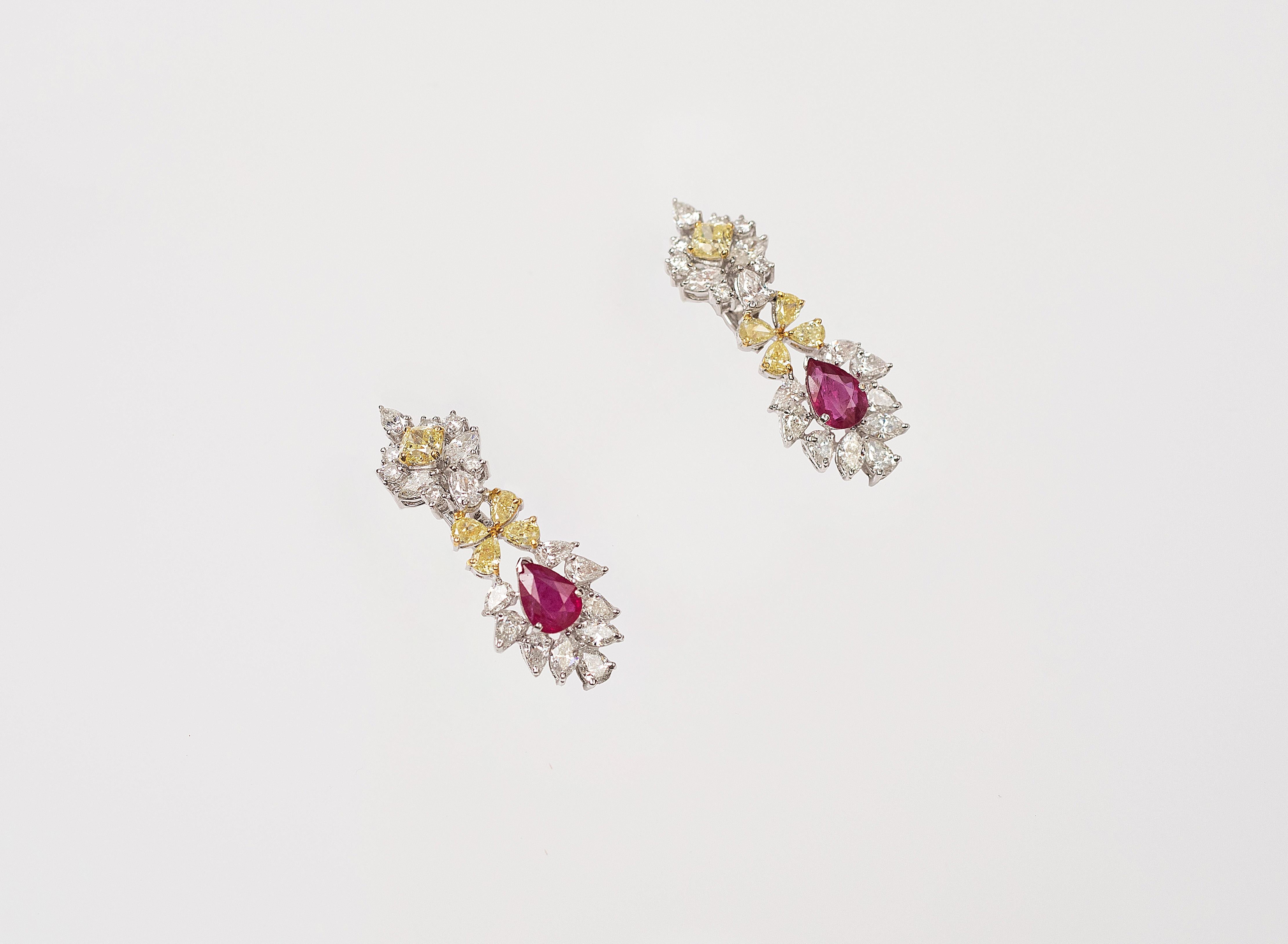 Handcrafted Earrings in 18K Gold Studded with Natural Fancy Yellow Diamonds, White Diamonds and Natural Heated Ruby.

Gold Weight - 18.160 gms

Diamond Details - 
Clarity - Vs-Si
Colour - Natural Fancy Yellow and G Colour

Ruby - Natural Ruby