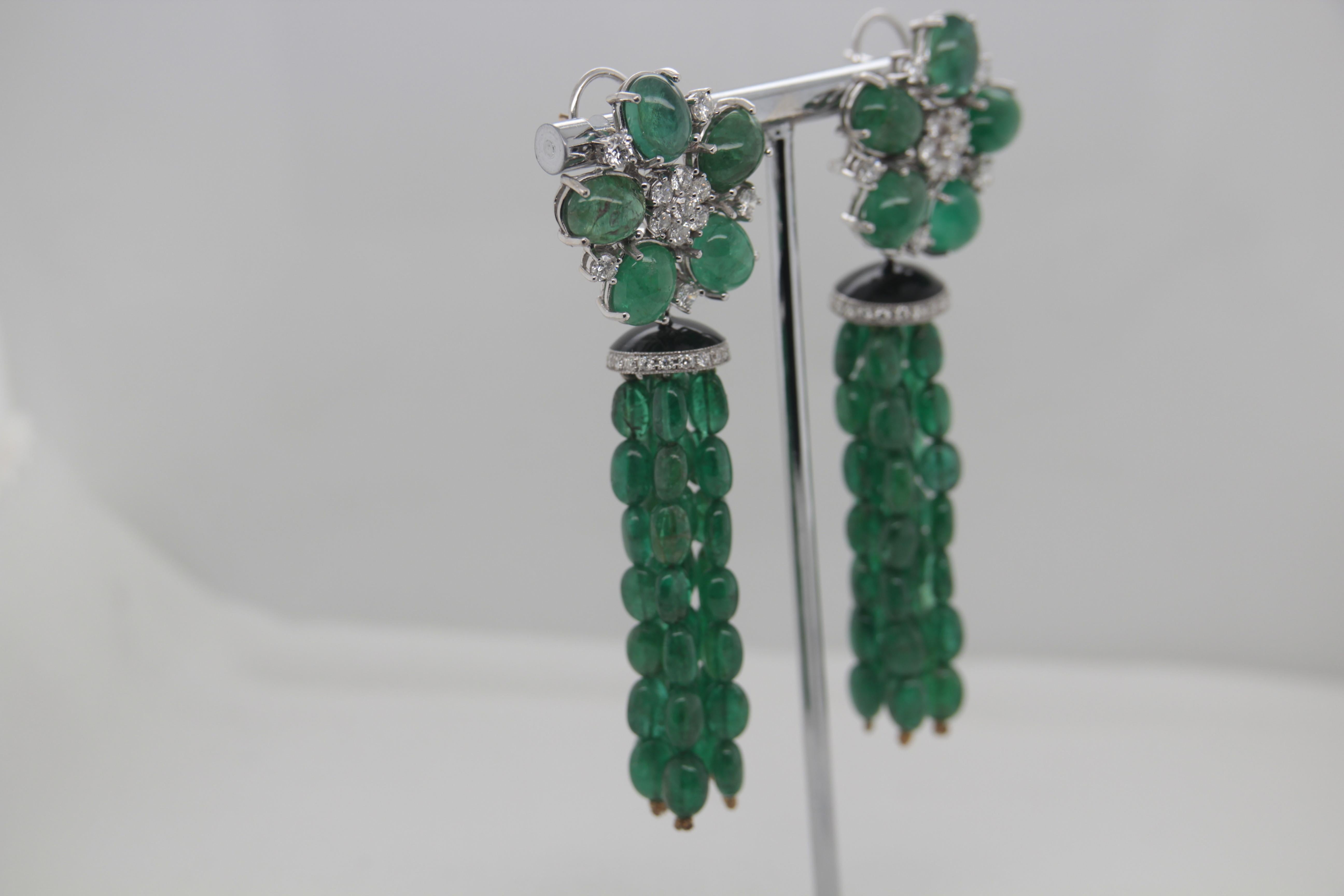 A brand new emerald and diamond earring in 18 karat gold. Emerald weight is 98.90 carat and diamond weight is 2.61 carat. Total earring weight is 37.90 grams.