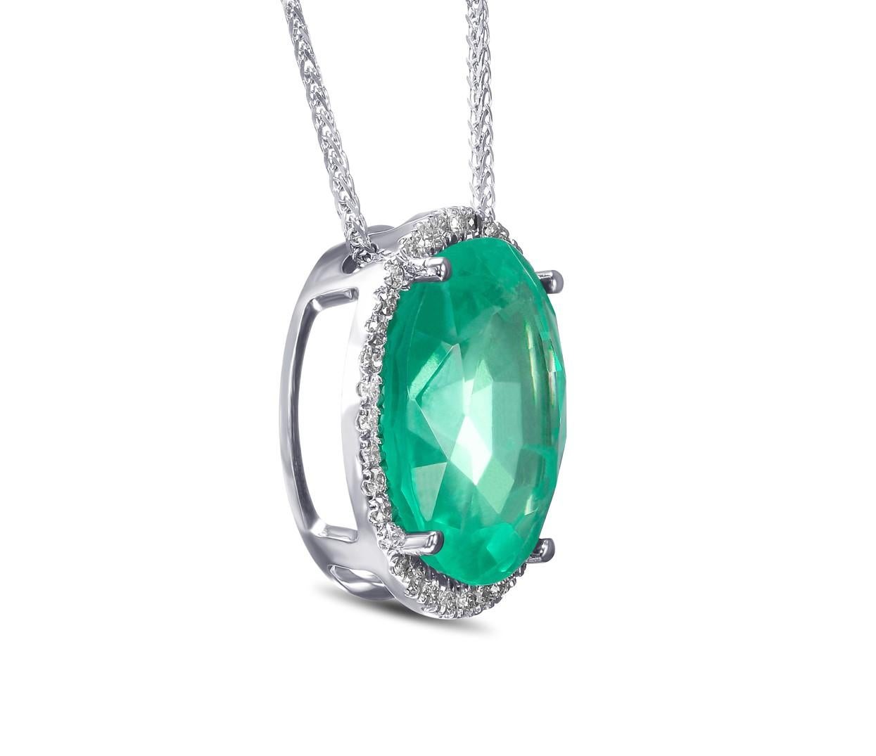 Don't miss your chance to own this unique and exquisite pendant necklace of top quality Emerald.

Center Emerald Stone:
Weight: 9.90 ct
Color: Green
Shape: Oval Mixed
Indications of Minor clarity enhancement with Oil

Side Stones:
0.50 cttw, J-K,