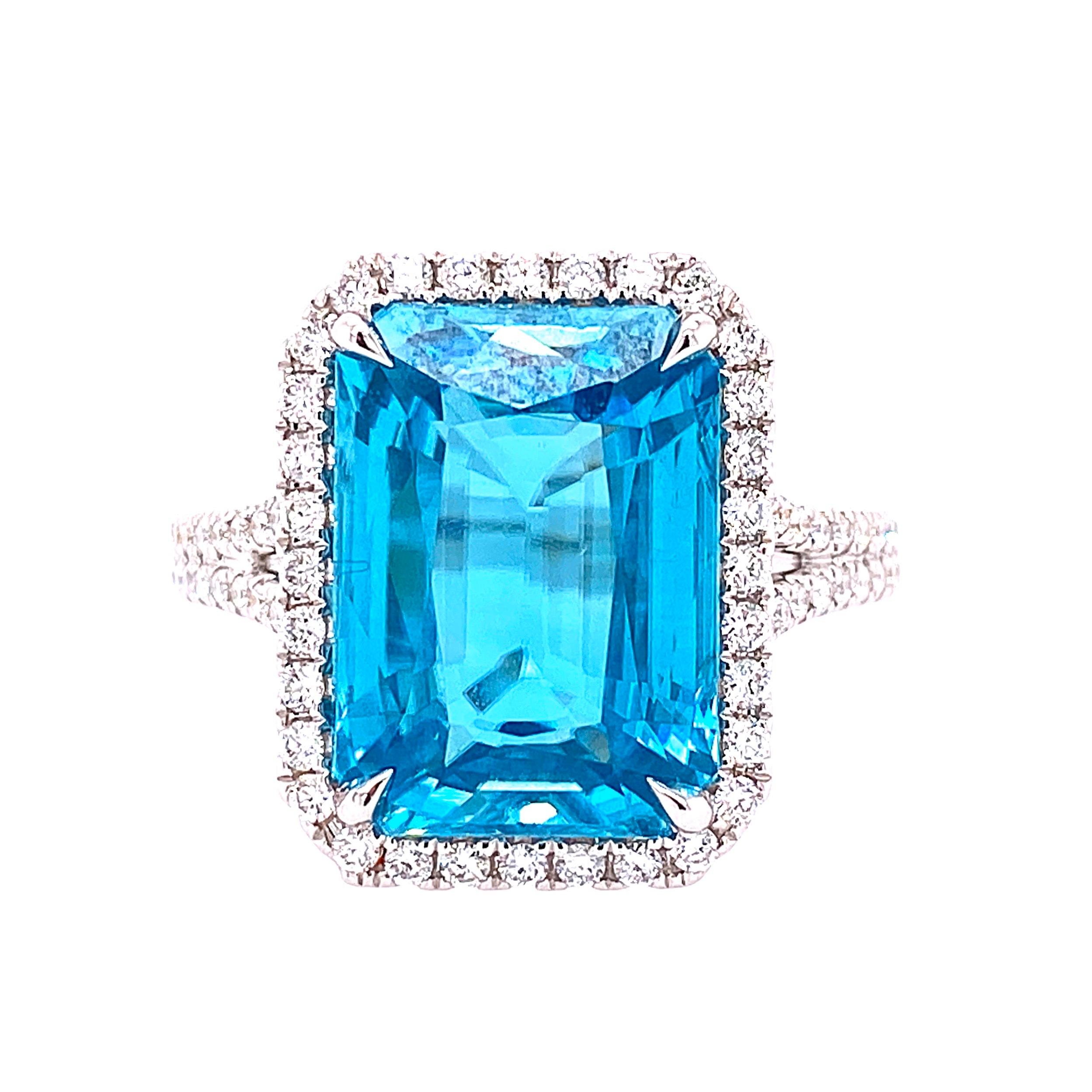 This stunning Cocktail Ring features a beautiful 9.91 Carat Emerald Cut Blue Zircon with a Diamond Halo, on a Double Diamond Shank. This Ring is set in 18K White Gold. Total Diamond Weight = 0.41 carats. Ring Size is 6 1/2.