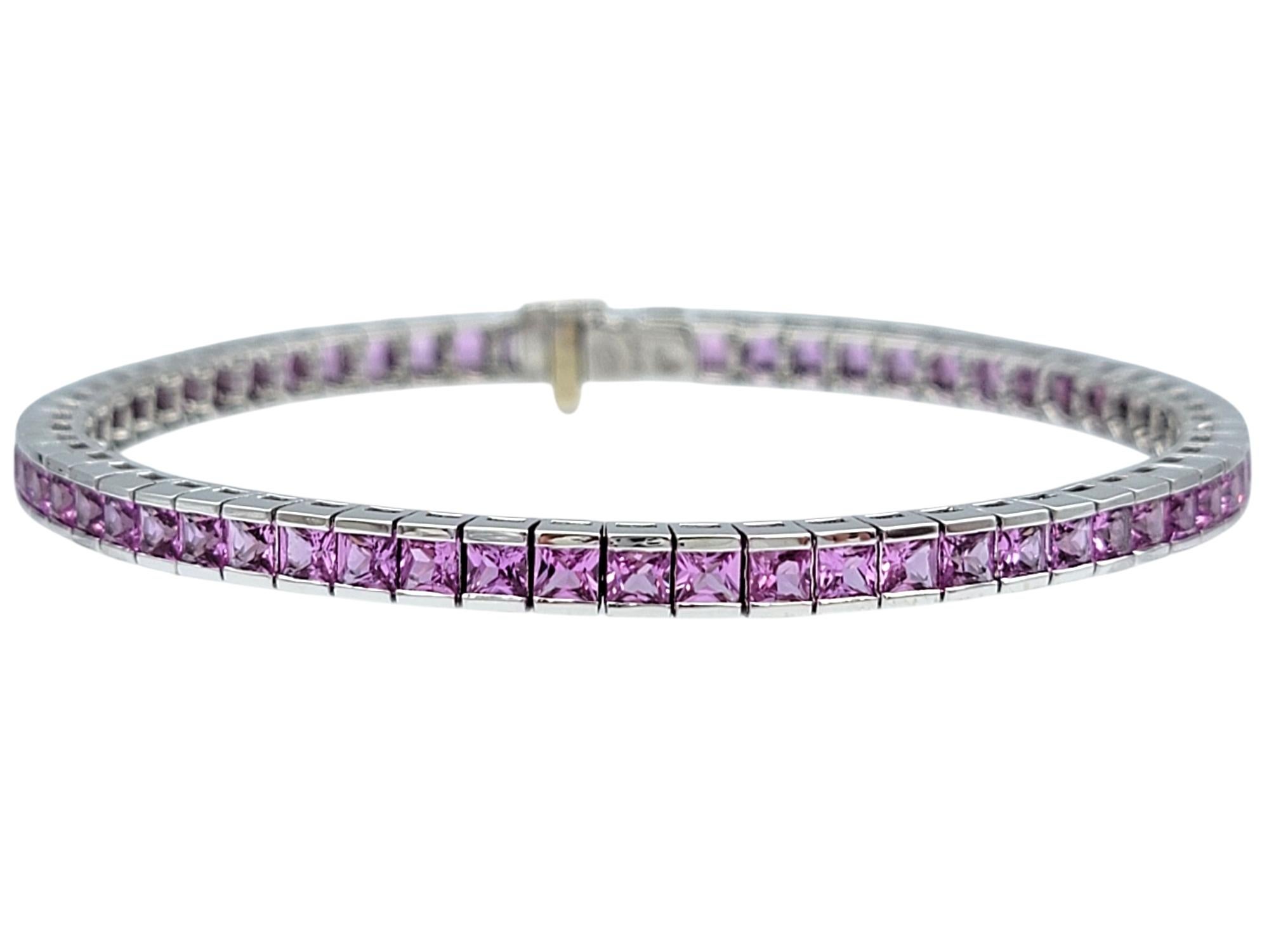 Exuding timeless sophistication, this exquisite tennis bracelet is crafted in 14 karat white gold and adorned with a stunning array of natural pink sapphires. Each meticulously arranged French cut pink sapphire showcases a captivating hue that