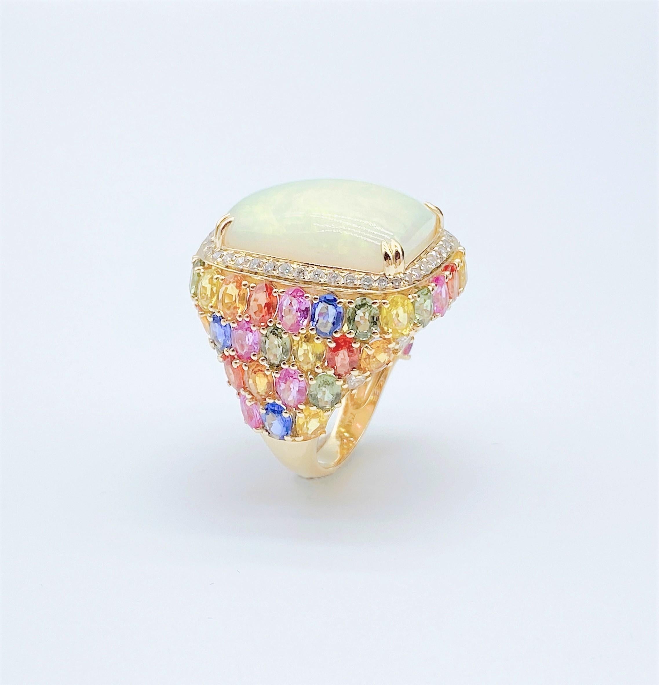 The Following Items we are offering is this Rare Important Radiant 18KT Gold LARGE Glittering and Sparkling Magnificent Fancy Large Opal and Fancy Rainbow Colored Sapphire White Diamond Ring. Ring Contains a Beautiful Gorgeous Large Round Opal