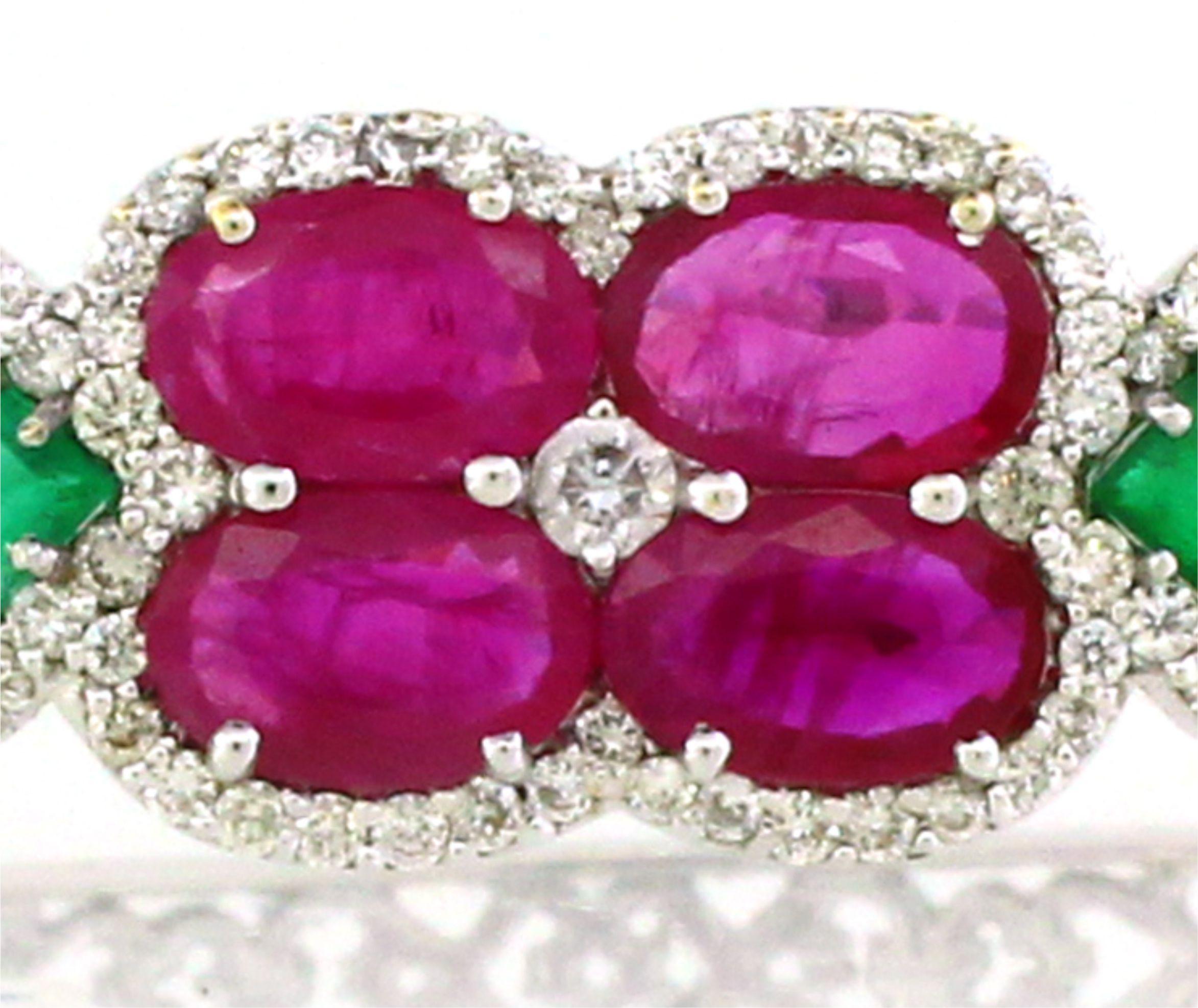 This exquisite cuff bracelet features two distinct units, each showcasing its own unique charm and elegance. The first unit is adorned with four oval rubies arranged in two pairs, each outlined with shimmering white round diamonds, highlighting