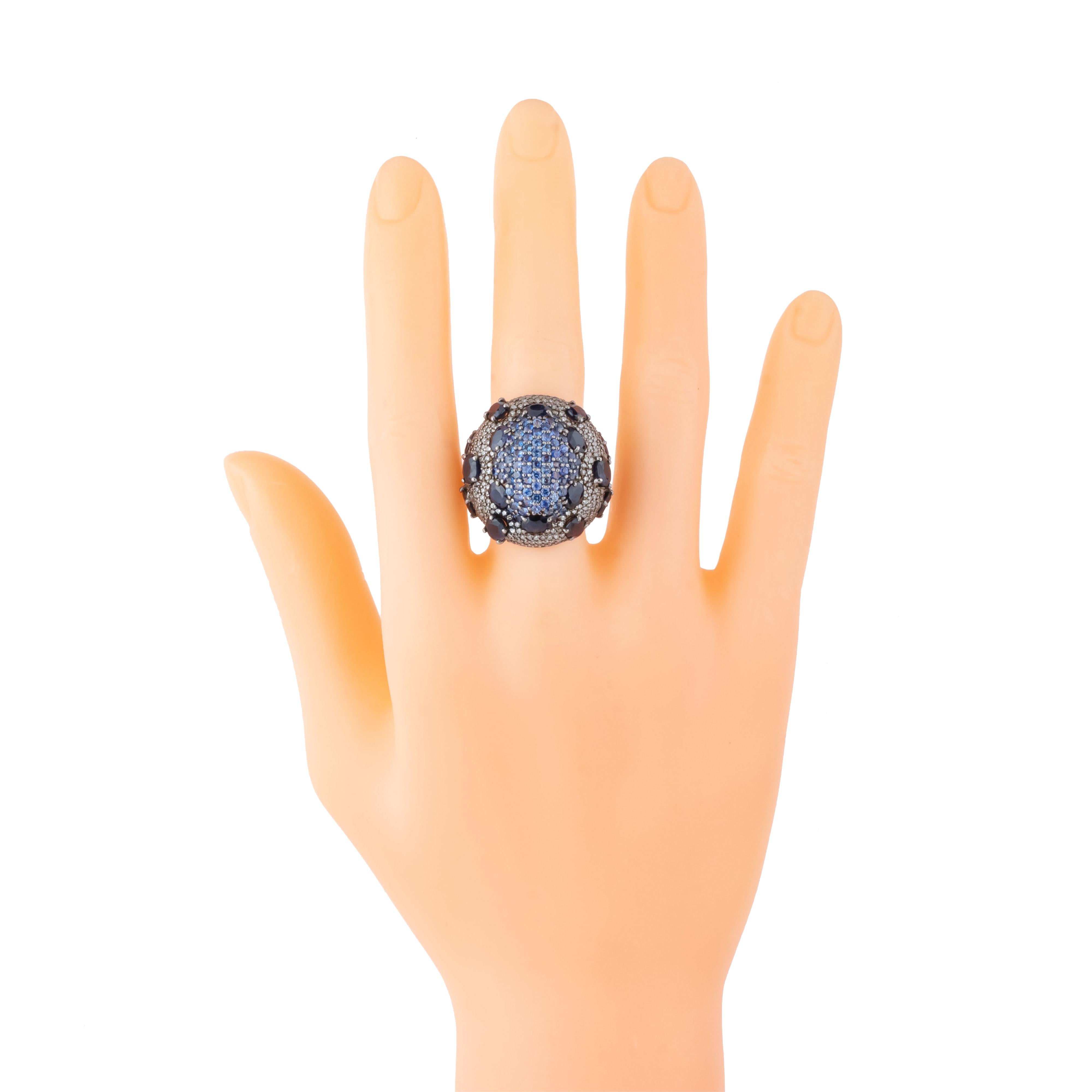 A breathtaking union of classic elegance and modern sophistication, the 9.95 Carat Diamond and Sapphire Cluster Ring captures the essence of timeless beauty. This exquisite piece features a meticulously crafted cluster design, where a central