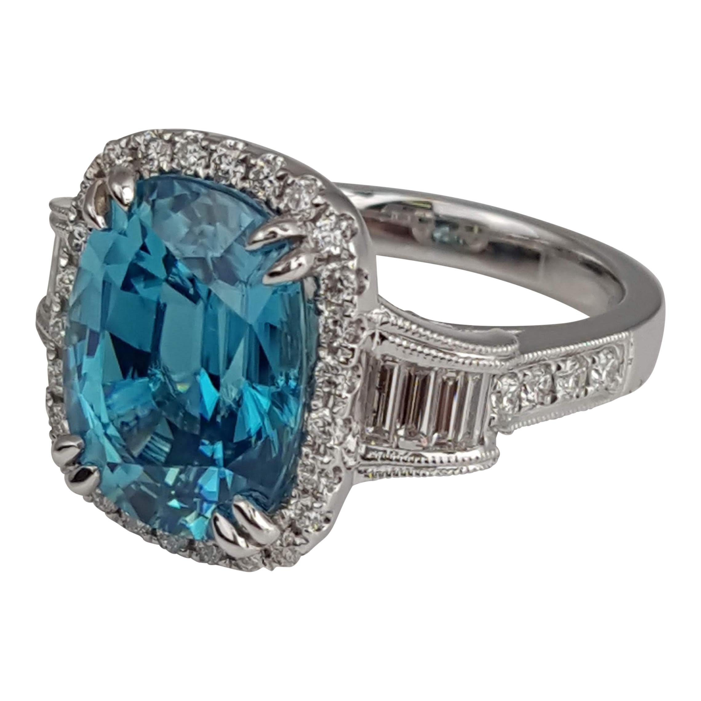 (DiamondTown) With a 9.95 carat oval cut Blue Zircon center, embellished by 0.74 carats round and baguette diamonds, this ring has a simple elegance suited for every occasion.

Center: 
9.95 Carats Oval Cut Blue Zircon
34 Round Diamonds total 0.50