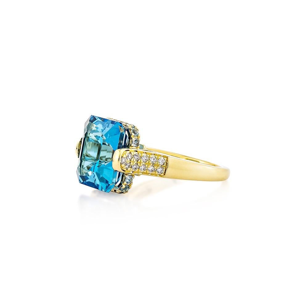 Octagon Cut 9.95 Carat Swiss Blue Topaz Fancy Ring in 18KYG with White Diamond. For Sale