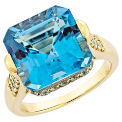 9.95 Carat Swiss Blue Topaz Fancy Ring in 18KYG with White Diamond.