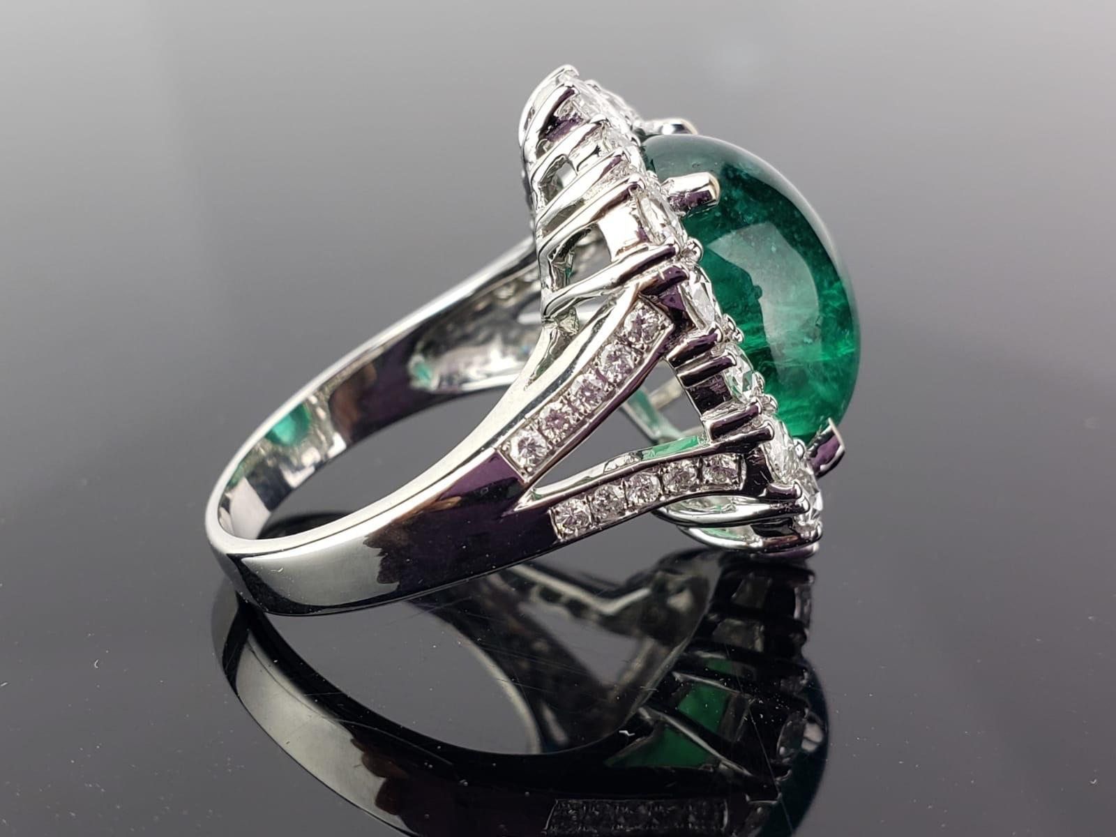 A gorgeous Zambian Emerald stone weighing 9.98 carats of an ideal colour and great lustre, completely transparent with very few naturally occuring inclusions. The Emerald and Diamonds all set in solid 18K White Gold. Free shipping provided.
