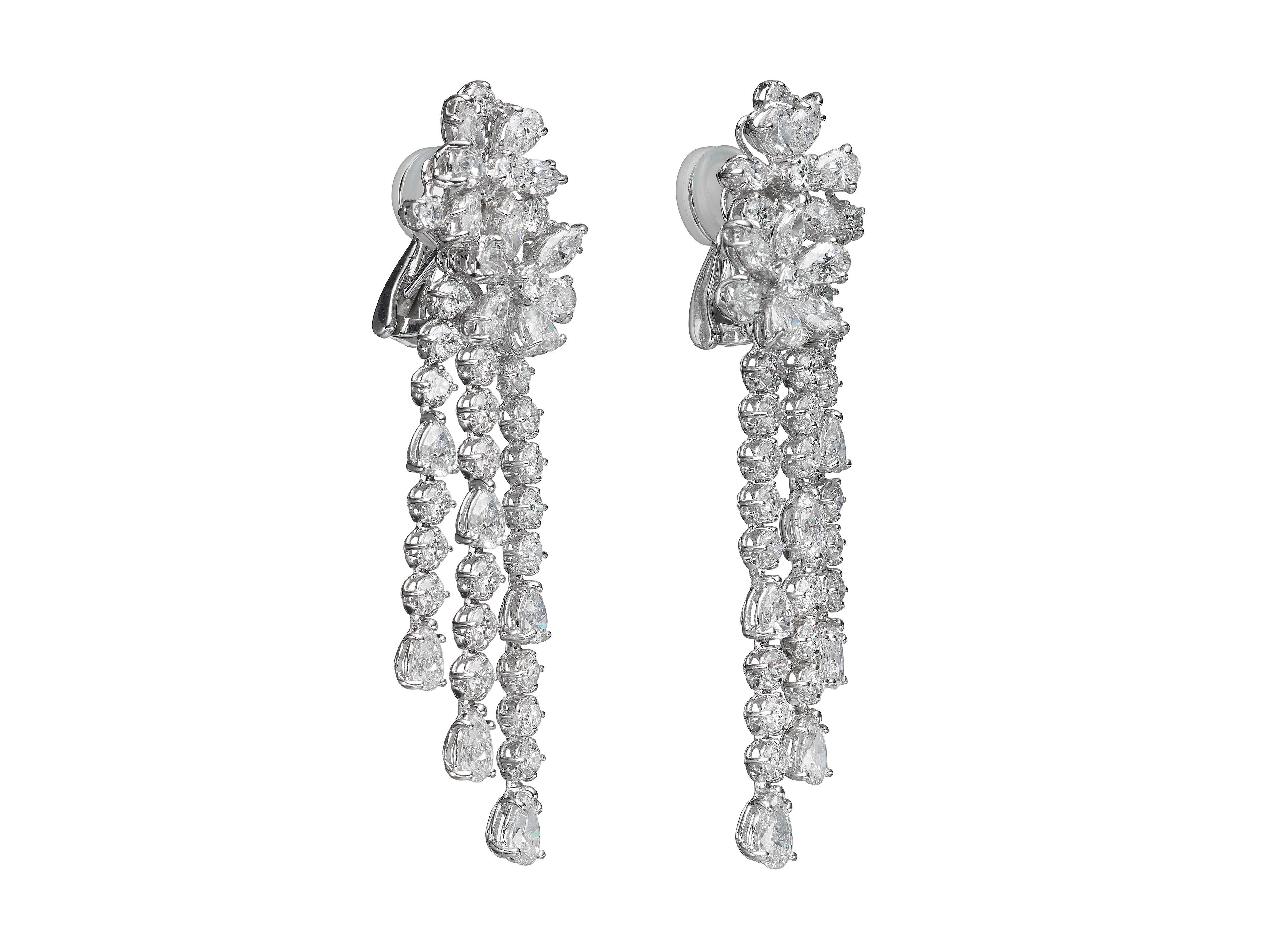 Butani's diamond chandelier earrings feature blooming floral-shaped diamond posts and a cascading silhouette of marquise-cut, brilliant-cut and pear-cut diamonds that are suspended below.  Total diamond weight is 9.98 carats.  Set in 18K white