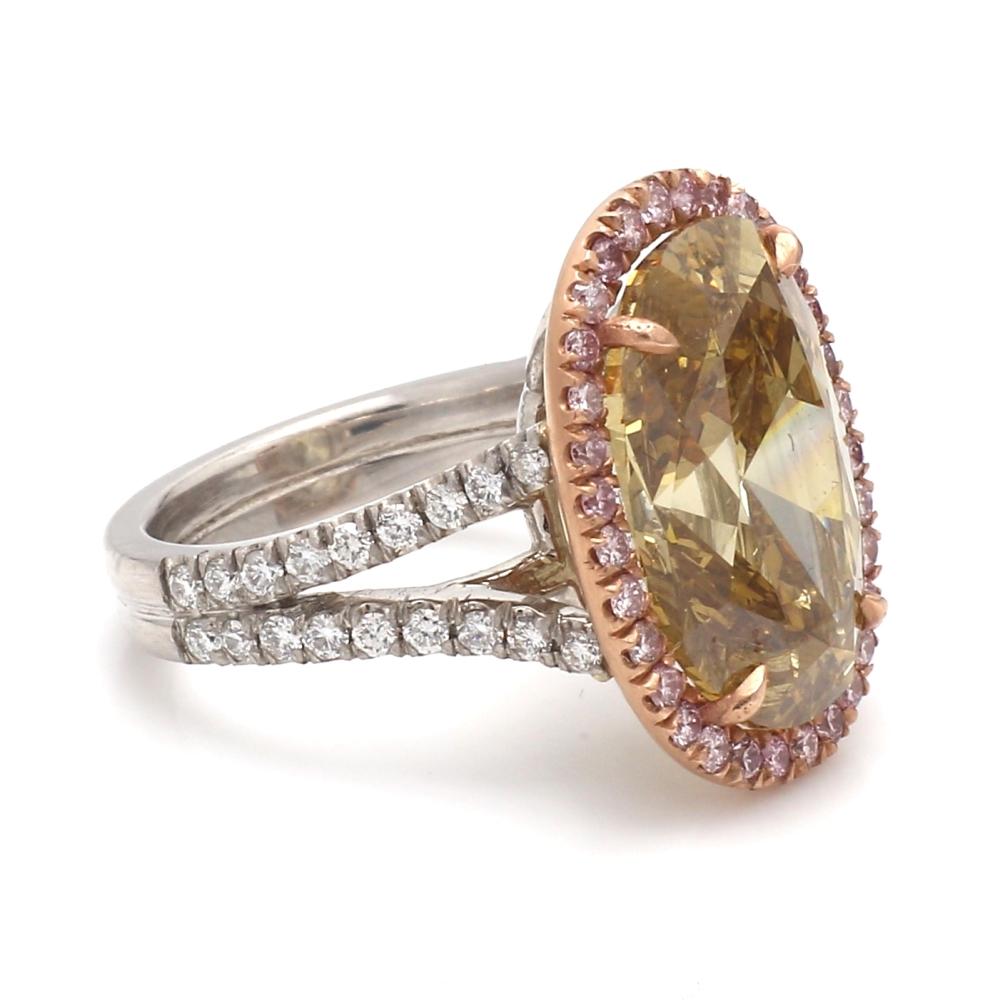 9.99ct Fancy Deep Brown-Yellow Oval Diamond, GIA certified
Gorgeous brown chocolate color diamond
Ring made in platinum and 18k, halo setting of .75ctw natural pink diamonds