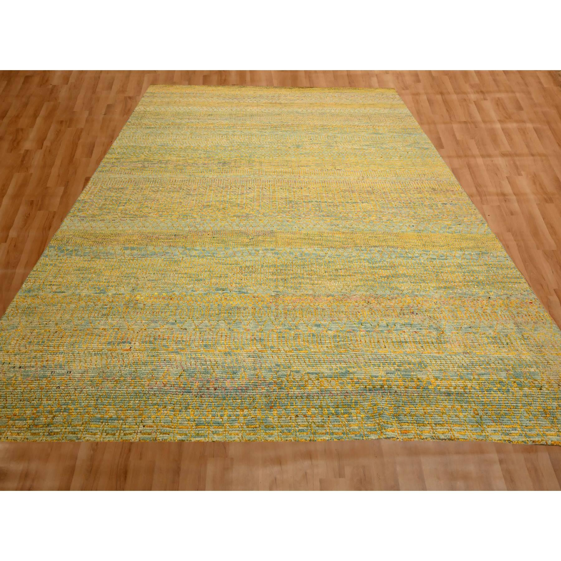 Golden Yellow, Modern Grass Design, Wool and Sari Silk, Tone on Tone, Hand Knotted, Oriental Rug
Primary materials: Wool & Sari Silk
Latex: No Pile 
height: 0.25 Inches
Style: Contemporary
Primary color: Yellow
Secondary colors: Green, Blue
Pattern: