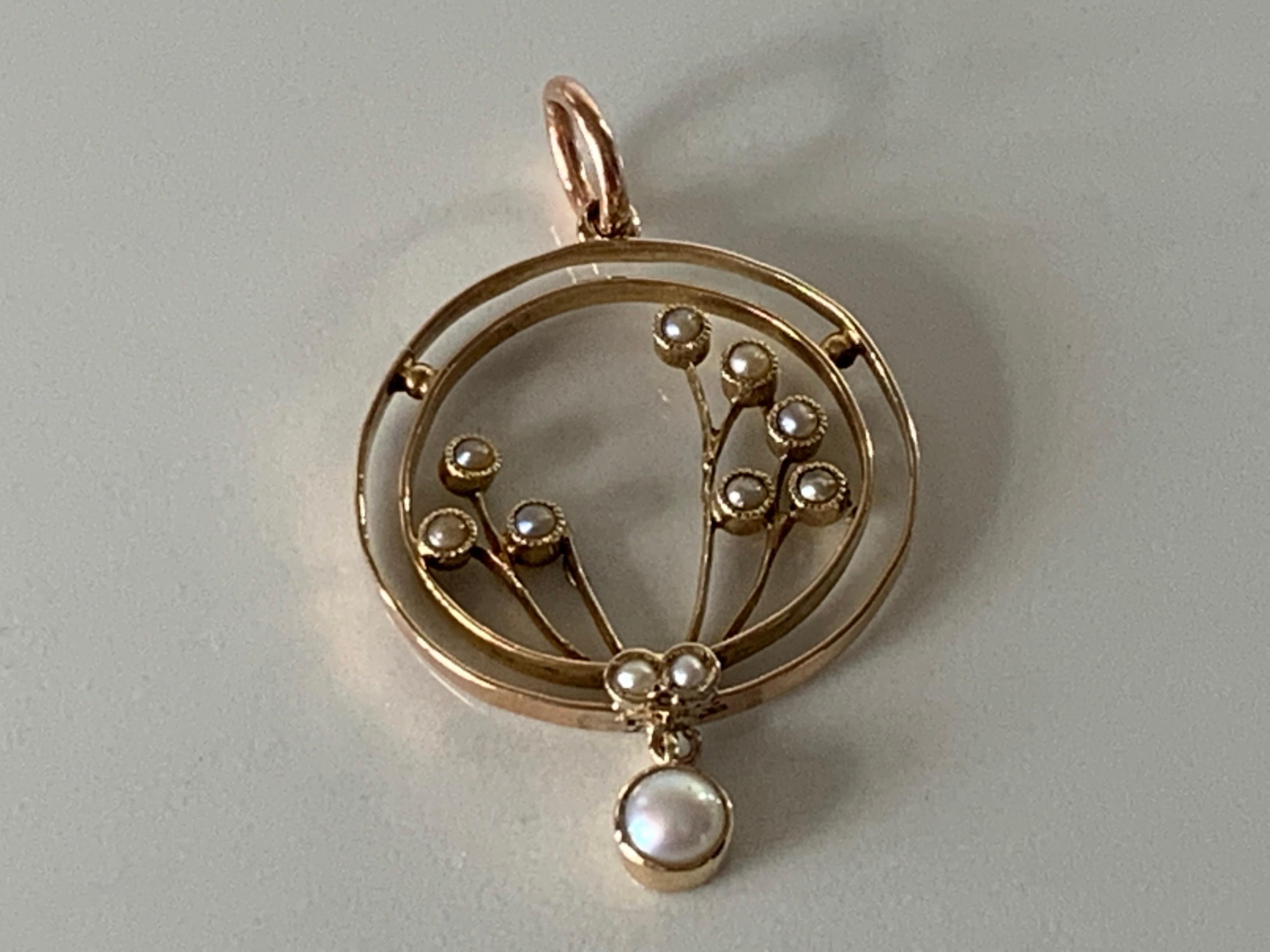 9ct 375 Gold Antique Pearl Pendant
Beautiful Edwardian Design 
depicting flowers with half pearls as each flower head
and finished by a larger swinging pearl 
The Rose Gold Bail gives that extra elegance 
Stamped 9ct on reverse 
and makers ? & F ?