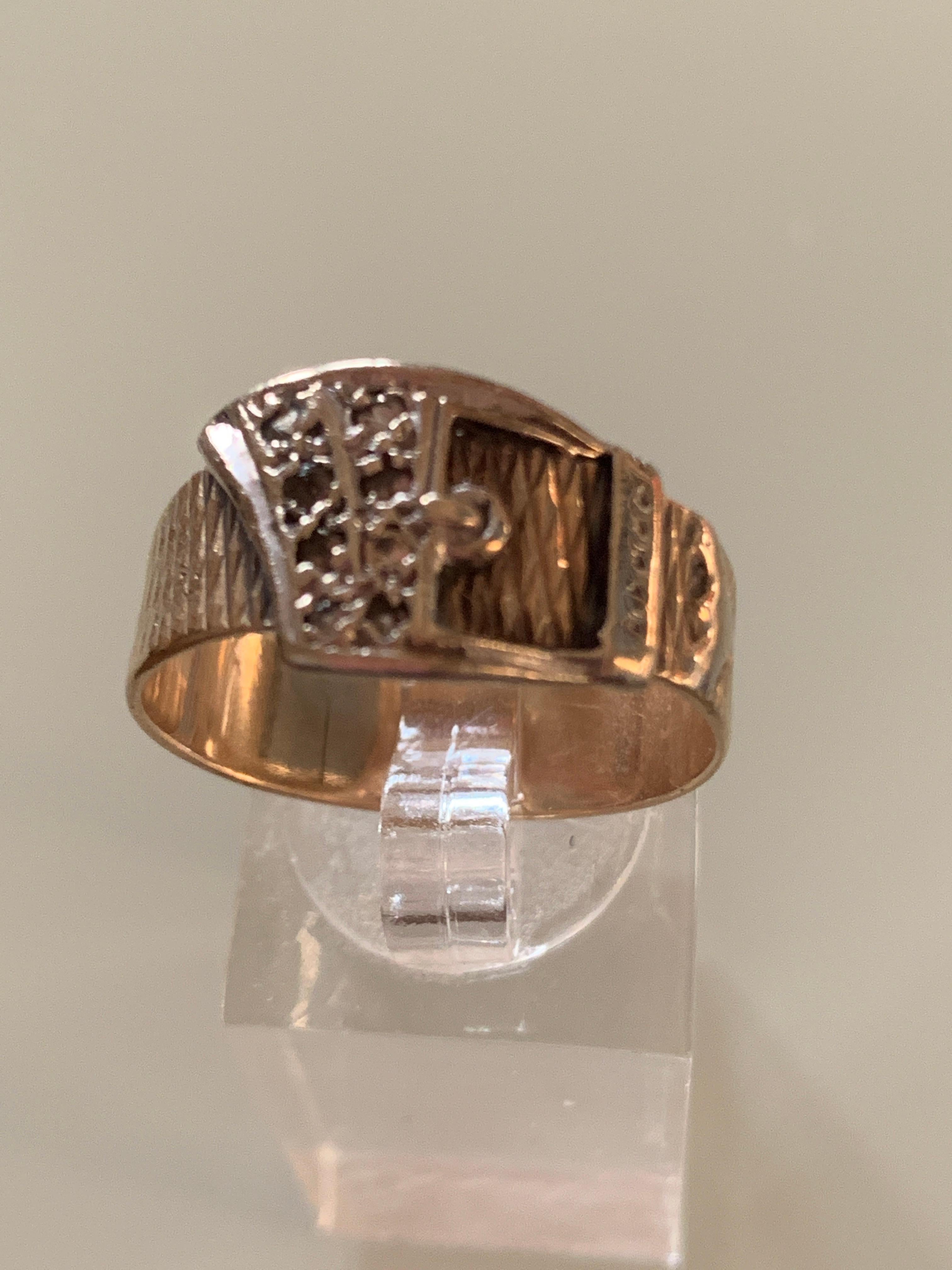 9ct 375 Gold Pave Diamond Buckle Ring 
Size U.K - V
        U.S -  10 5/8
Weight 4.42 grams
By Goldsmiths Fred Manshaw
Dated London 1964