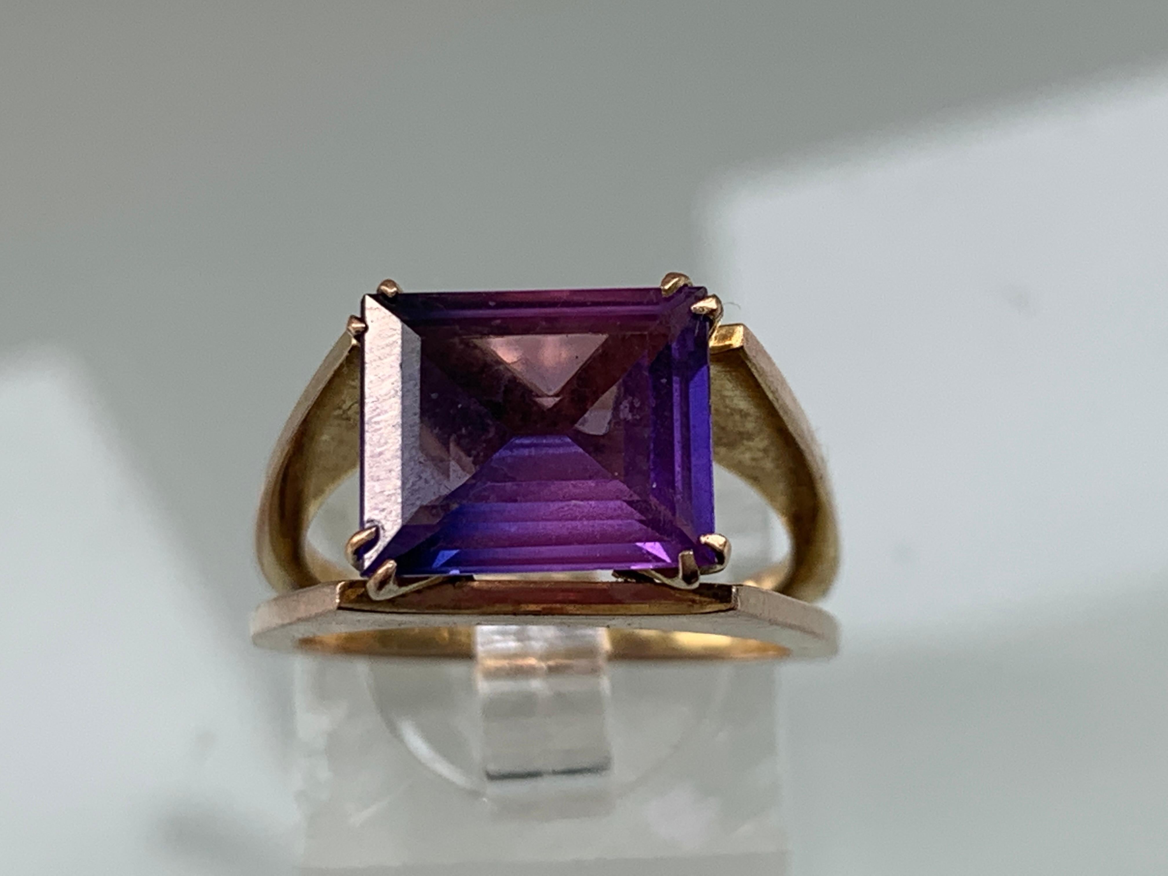 9ct 375 Gold Jack Gutschneider Designer Amethyst set Ring 
Earlier piece 1950s - 1960s 
Gemstone - unidentified Purple baguette cut stone
please see image for size