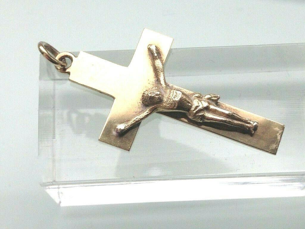 9ct 375 Gold Vintage Crucifix
Dated 1956. 
By Payton Pepper and sons 
Size 3.5 cm x 2 cm 
Weight 2.63 grammes 
Hallmarked on reverse
and on The Closed Jump ring