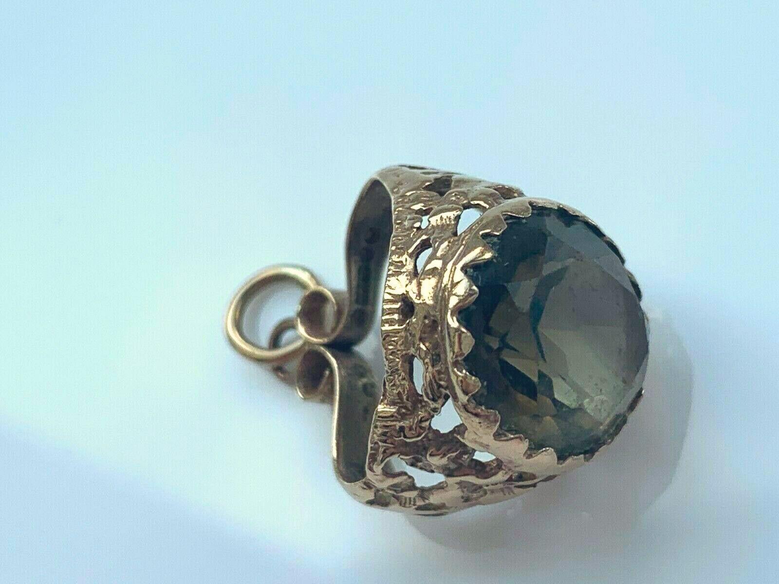 Rare Smoky Quartz Charm
In the shape of a ring 
holding a genuine smoky quartz gem stone
Fully Hallmarked 