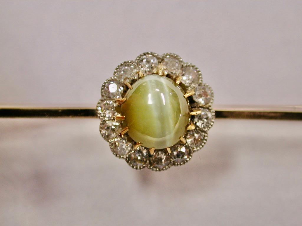 Old Mine Cut 9ct Bar Brooch with Chrysoberyl Cats Eye & Diamond Surround in Centre, Circa 1900 For Sale