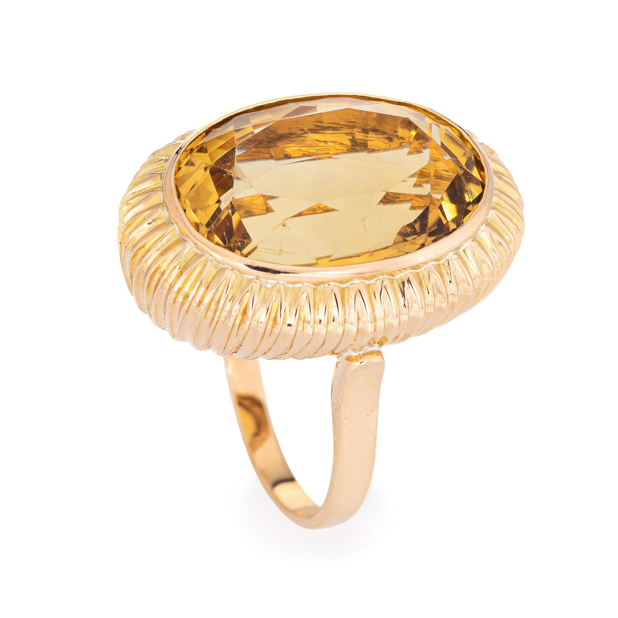 Stylish estimated 9 carat citrine cocktail ring (circa 1950s to 1960s) crafted in 14 karat yellow gold. 

Faceted oval cut citrine measures 18mm x 13mm (estimated at 9 carats). The citrine is in very good condition and free of cracks or chips. 