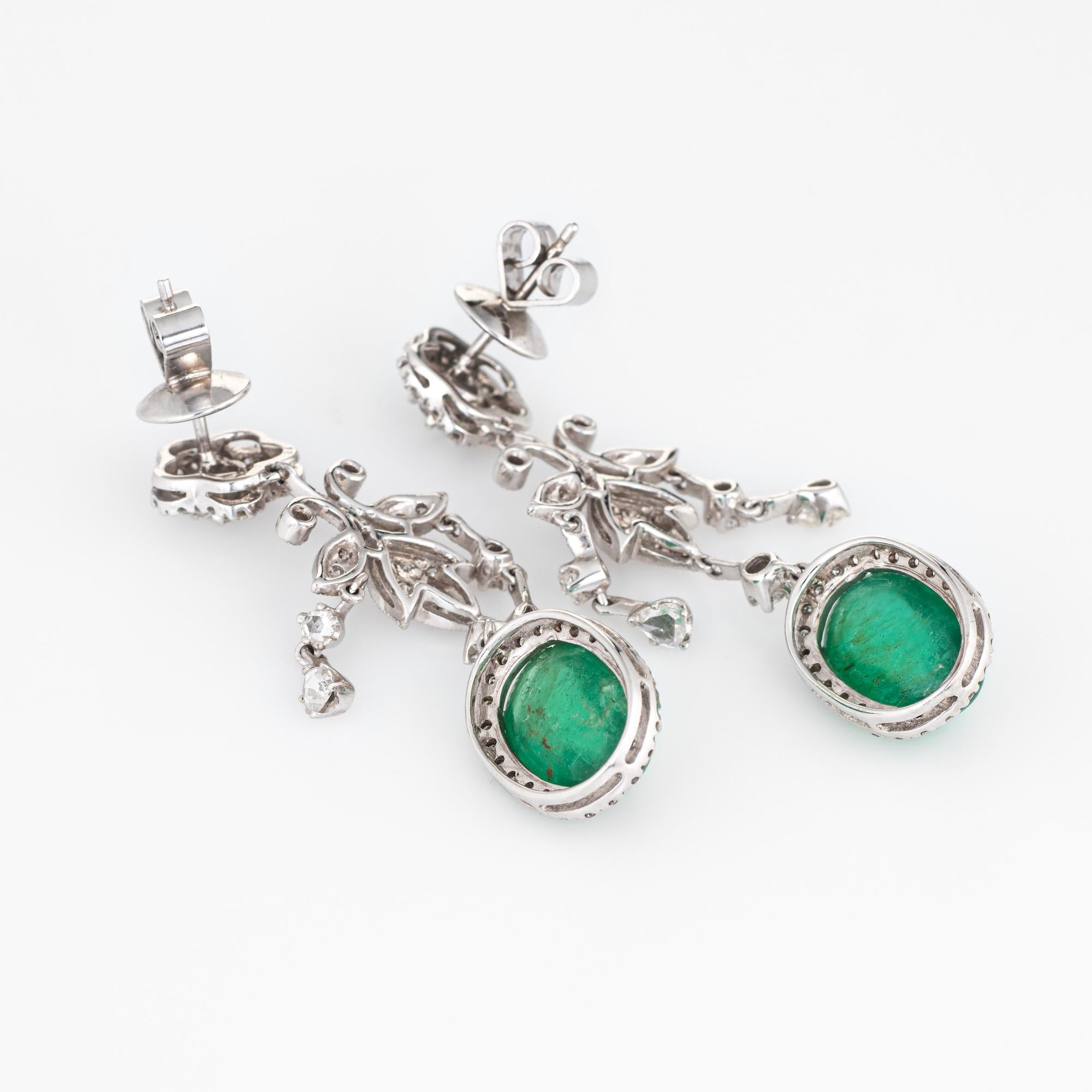 Elegant pair of estate diamond & emerald drop earrings crafted in 18k yellow gold. 

Rose & round brilliant cut diamonds total an estimated 1.50 carats (estimated at H-I color and VS2-I1 clarity). The cabochon cut emeralds each measure 12mm x 8.5mm
