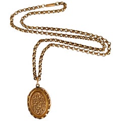 Relicario y cadena antiguos de oro de 9 ct