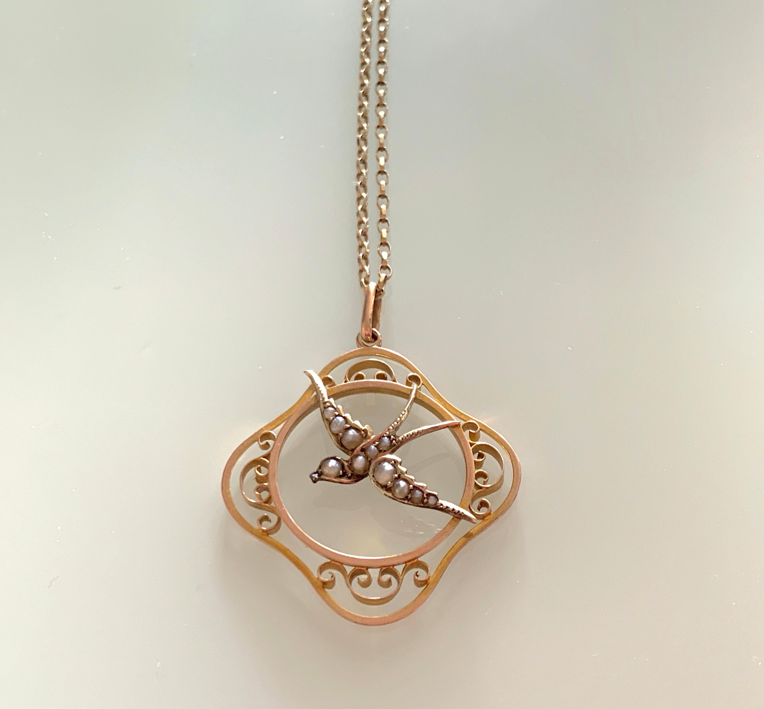 9ct Gold Antique Pendant
depicting a bird decorated with cultured seed pearls
Pendant is stamped 9ct on reverse
Pendant Size - 3.5 cm x 3.5cm
Pendant Weight - 2.65 grammes

9ct Gold Chain is fully Hallmarked
and is modern .
Chain weight 2.75