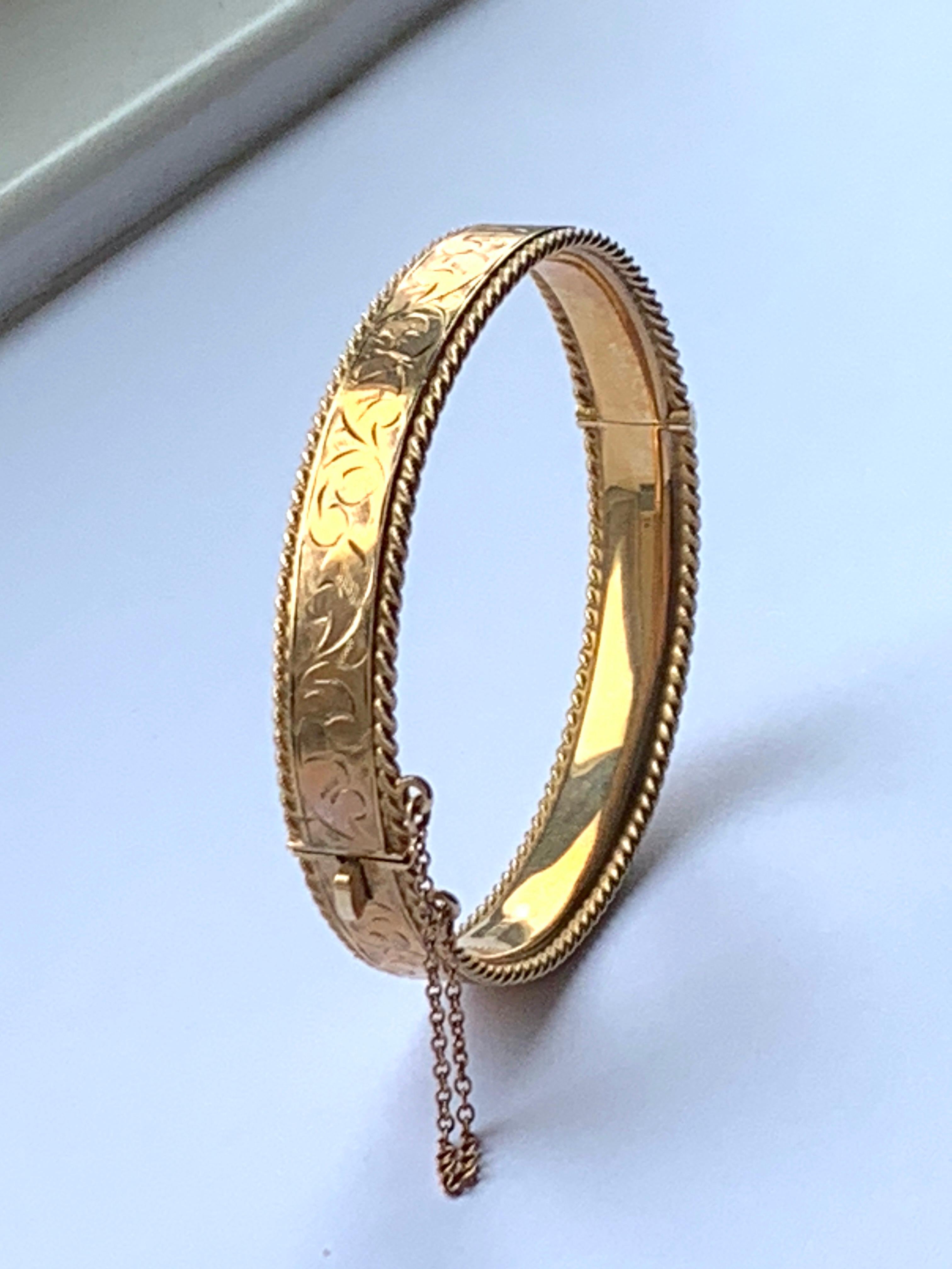 9ct 375 Gold Bracelet
With beautiful floral en-scrolling engraving
Tight and secure fastener - with strong safety chain
Makers PPLd - Payton Pepper Limited
Dated 1964
Perimeter 17.45 cm : 6.8 Inches
Maximum wrist fit 6.25 Inches
Bracelet Depth   8mm