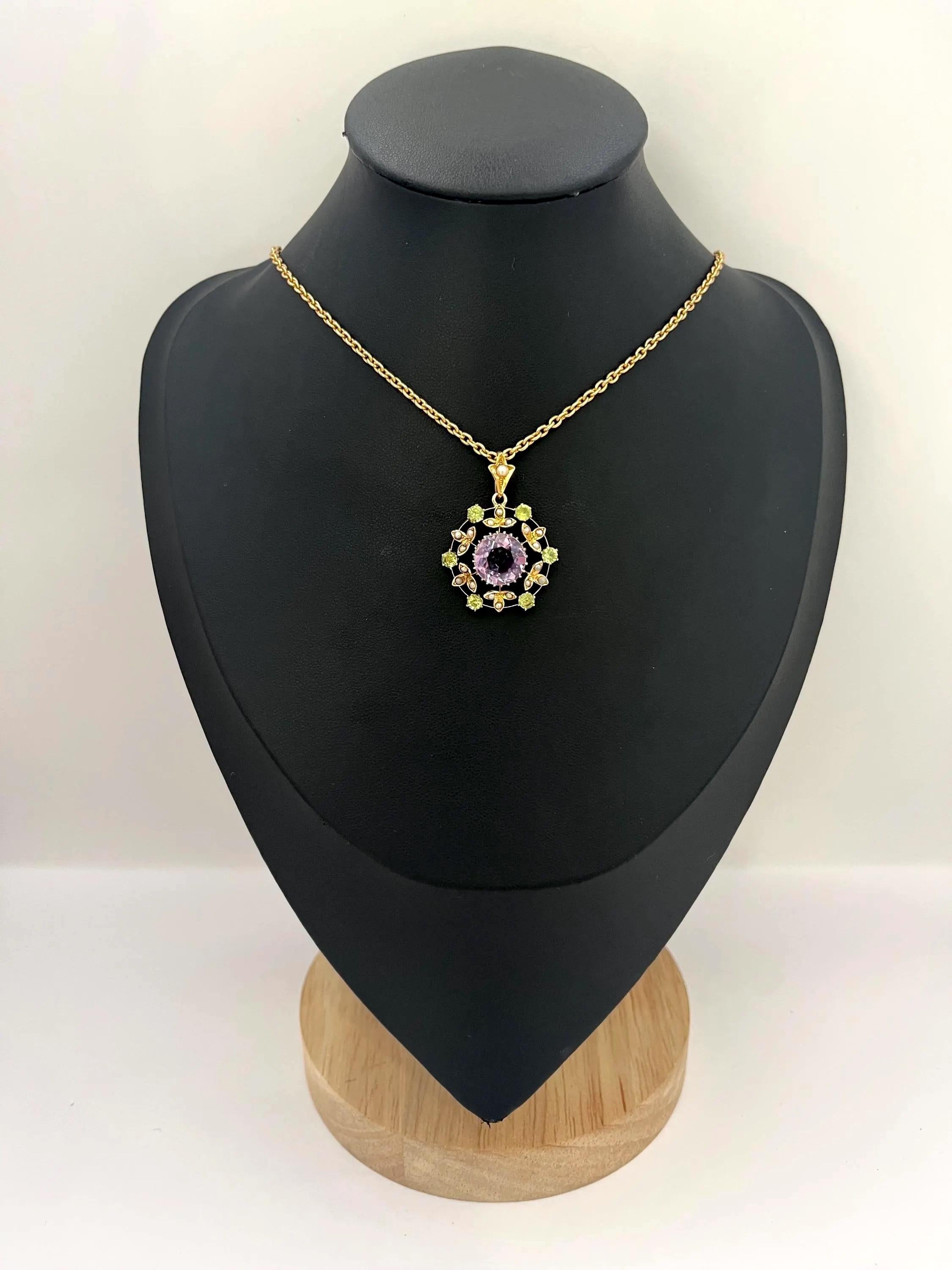 Antique Suffragette Pendant 

9ct Gold

Circa 1910 

* The chain is sold separately

Suffragette pendant in 9ct yellow gold, set with approximately 3 carat round-cut amethyst at the centre. Surrounding the amethyst are six peridots and eighteen seed
