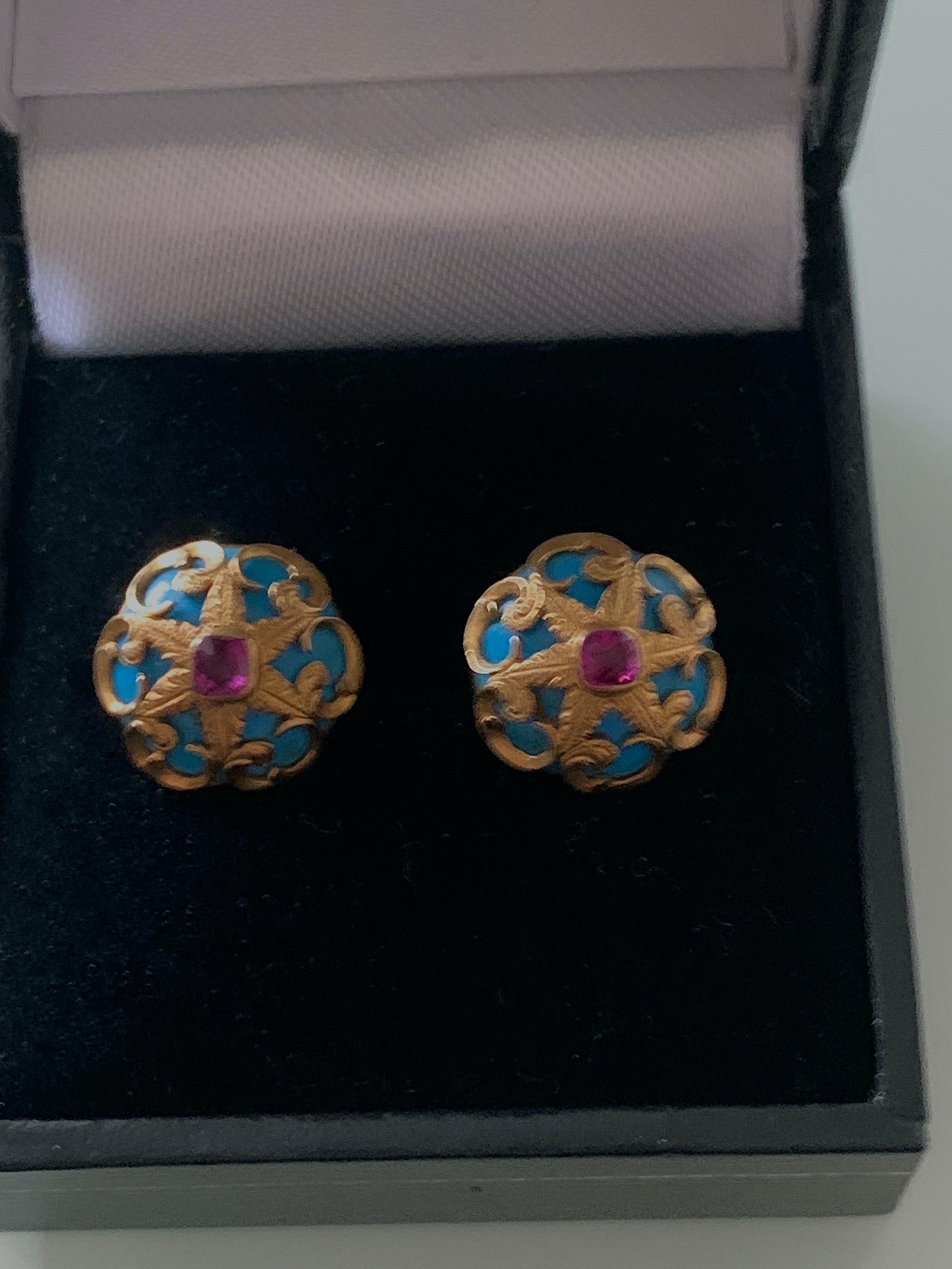 Exquisite 
9ct Gold Fret work turquoise earrings
with central rubies
each ruby is approx 0.16 carat

the rubies are very clear and pinkish in colour
Stamped 9ct on reverse 
