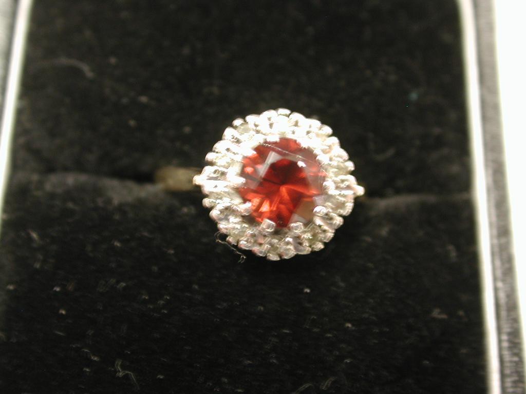 9ct Gold Garnet & Diamond Cluster Ring dated 1978,London Assay
In pristine condition, looks like unworn. 
Size I, english sizing