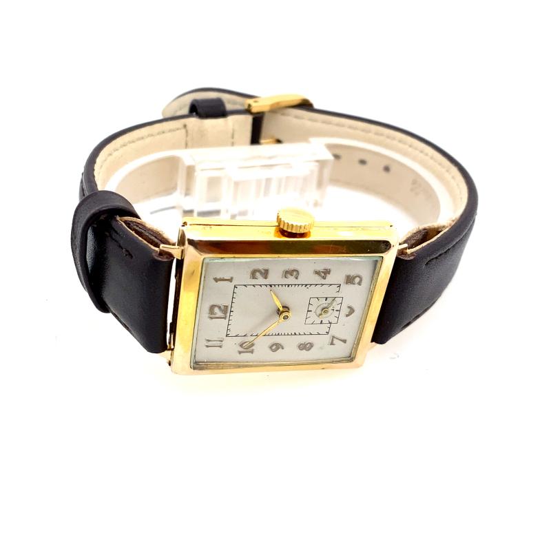 This 9ct Gold gents rectangle vintage watch is made by B.W.C. London and is a timeless piece. The watch is designed in a rectangle shape with vintage style lugs and a white dial. The watch also has brown leather strap.

Additional Information:
Total