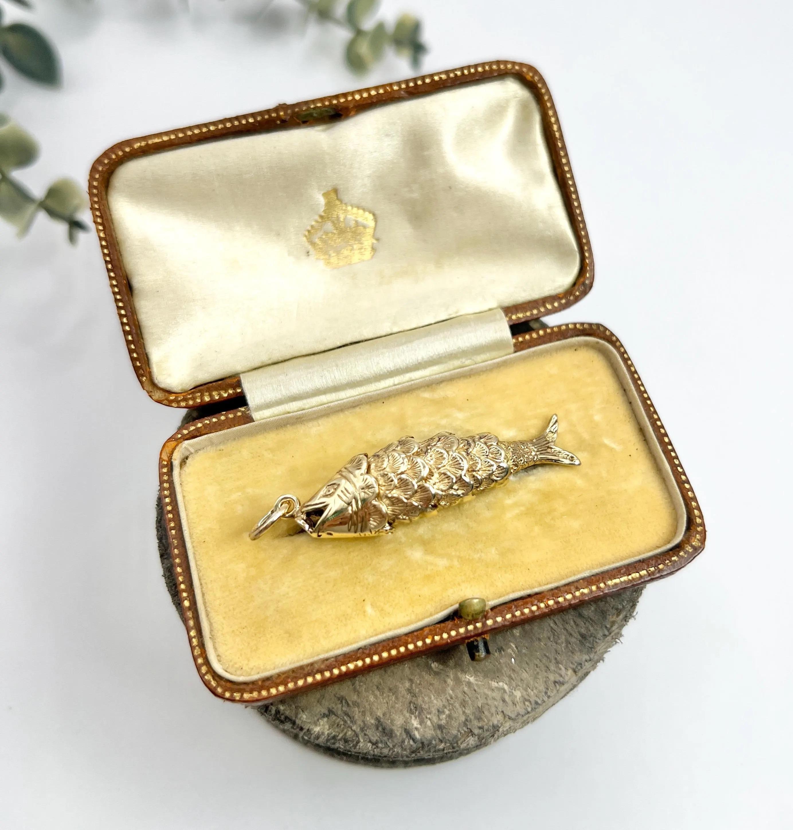 Lucky Fish Pendant

9ct Gold Stamped

Hallmarked London 1978

Makers Mark G & T

Dive into elegance with our stunning vintage 9ct gold lucky fish pendant, a striking piece that embodies timeless charm. This large pendant showcases a beautifully