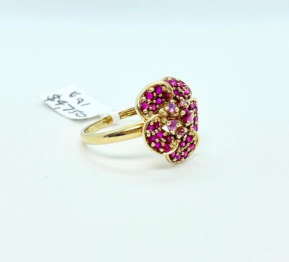A Unique Piece 'Flower on the Finger'!

This gorgeous ring features 34 x Natural, Round Cut Rubies that weigh approximately 1.09ct and are set in petals to form a flower cluster.

The Rubies are medium light red in colour and they are set in 9ct