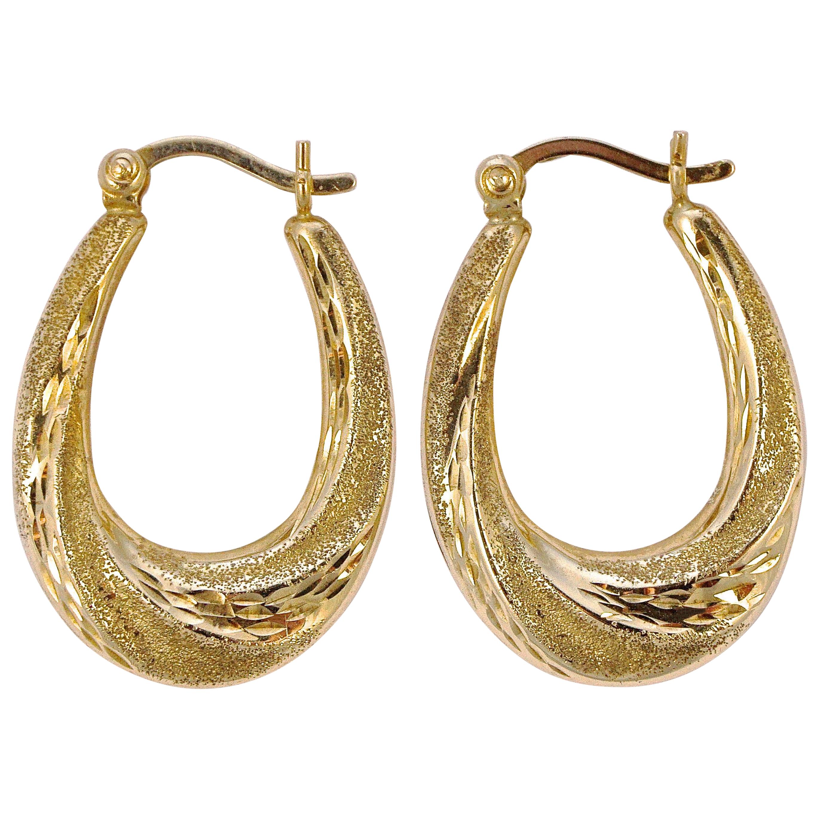 9ct Gold Textured and Diamond Cut Oval Hoop Earrings For Sale