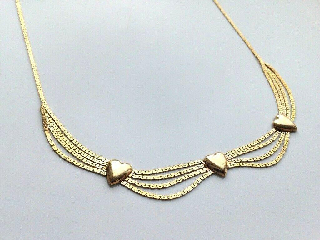 Beautiful Vintage Necklace 
formed of four main strands adorned with three hearts 
Striking necklace - but also comfortable for every glamorous day.
Length is 16' Inches - so sits quite high on the neck
Stamped 375 in several places 
makers marks