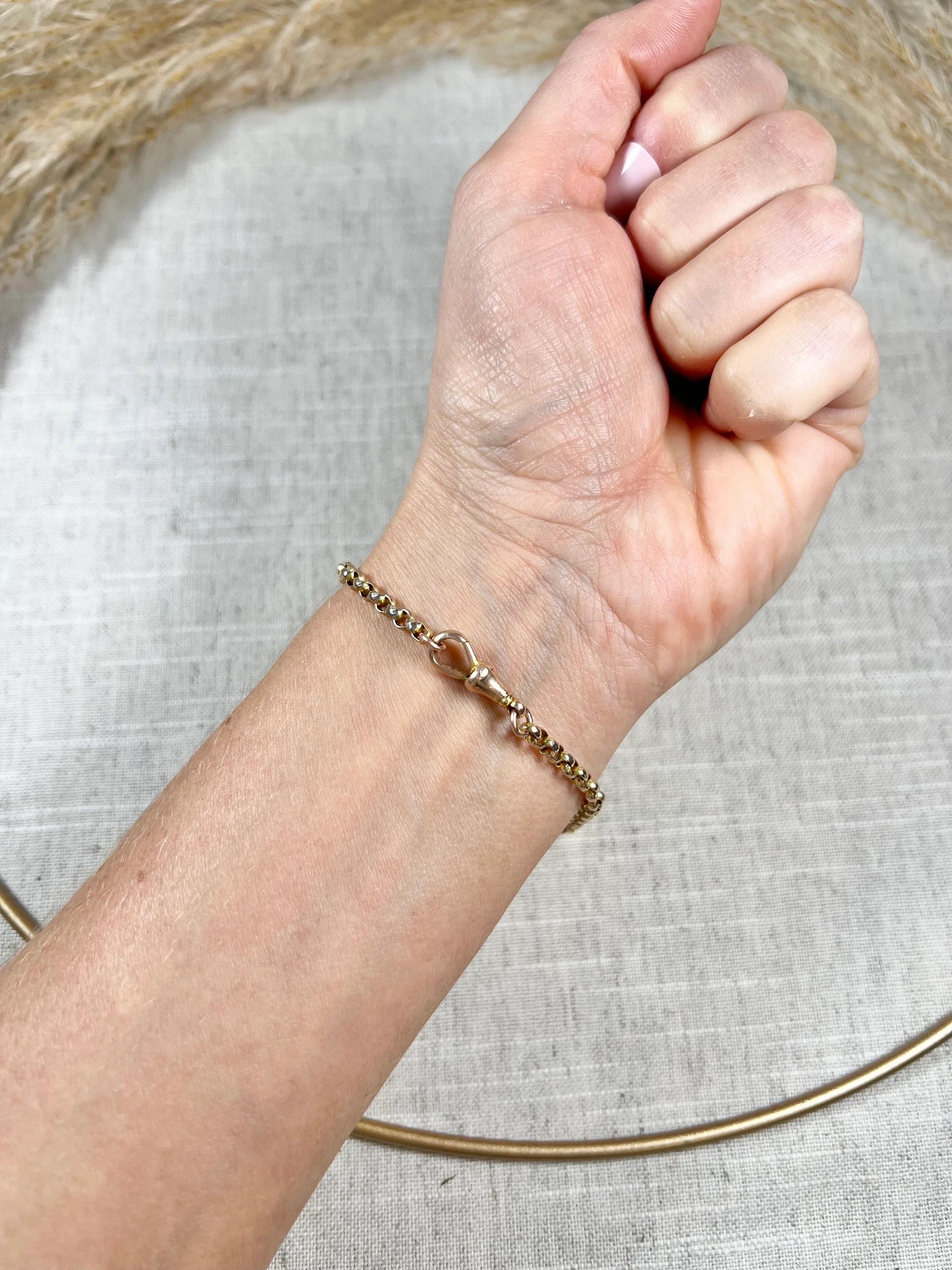 Antique Rose Gold Bracelet 

9ct Rose Gold Stamped 

Circa 1900

This antique bracelet is a true masterpiece, featuring a stunning 9ct rose gold faceted belcher link and paper clip link design. The bracelet is elegantly crafted with a swivel clasp
