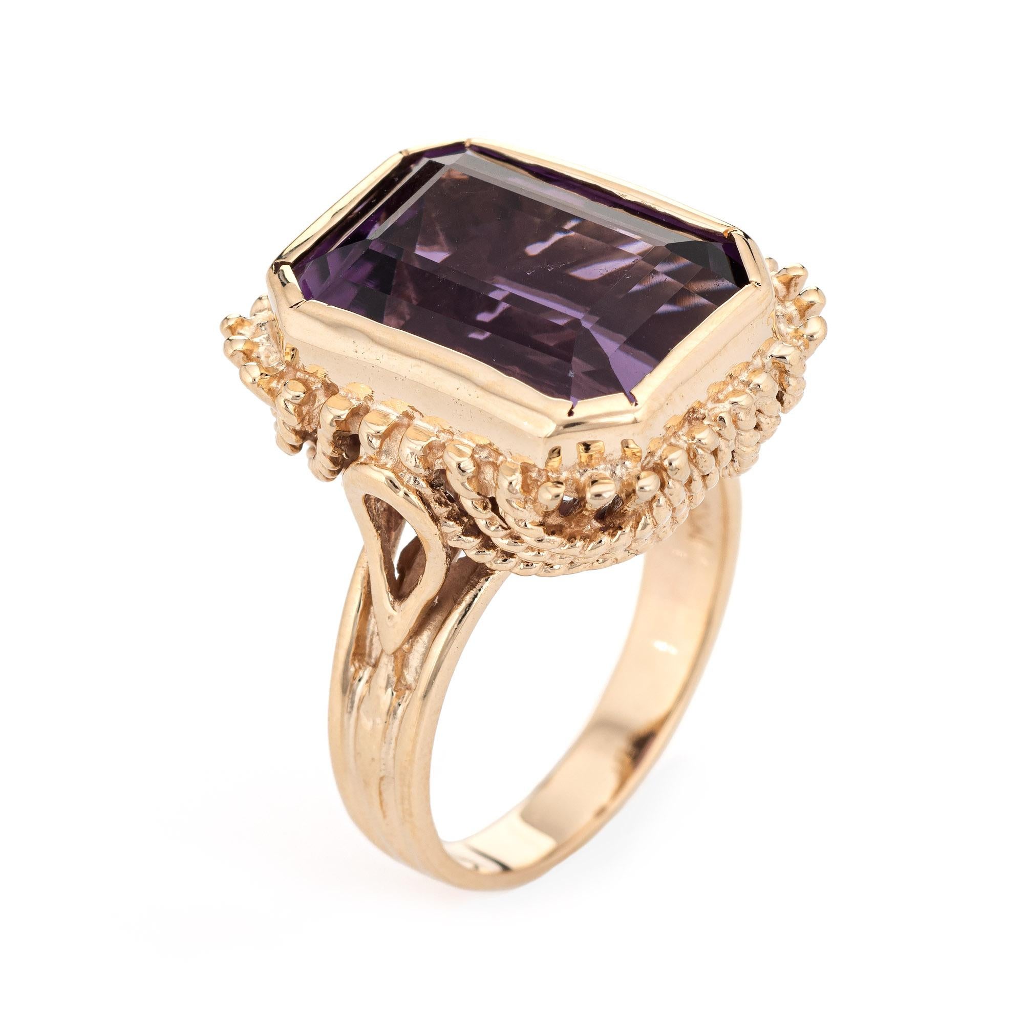 Stylish vintage amethyst square cocktail ring (circa 1970s to 1980s) crafted in 14 karat yellow gold. 

Emerald cut amethyst measures 16mm x 11mm (estimated at 9 carats). The amethyst is in very good condition and free of cracks or chips. 

The rich