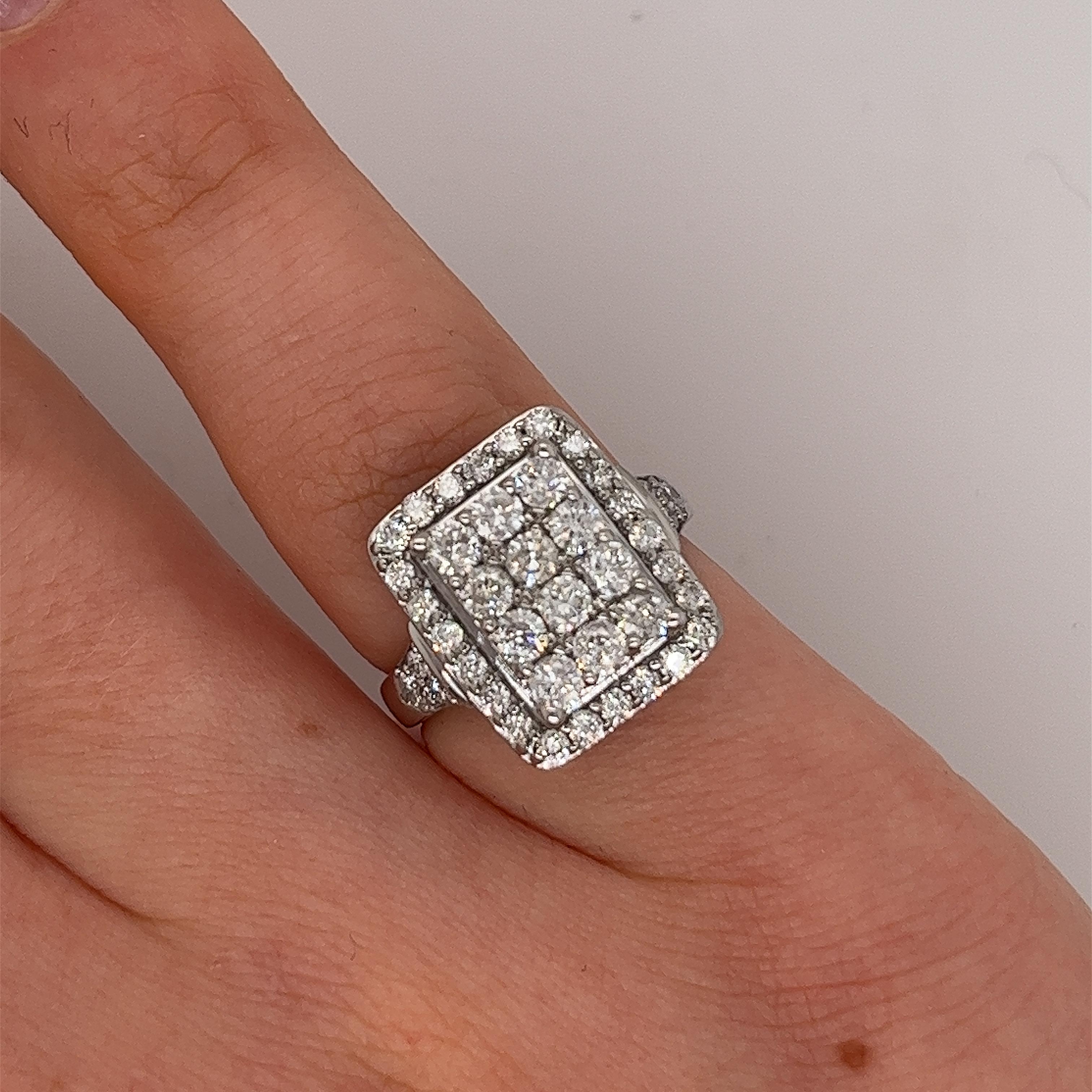 Elegance and sophistication our 
9ct white gold 1.20ct rectangle-shaped diamond ring 
with diamond-set shoulders, designed to captivate hearts
and commemorate eternal love.

Total Diamond Weight: 1.20ct
Diamond Colour: H
Diamond Clarity: I1
Width of