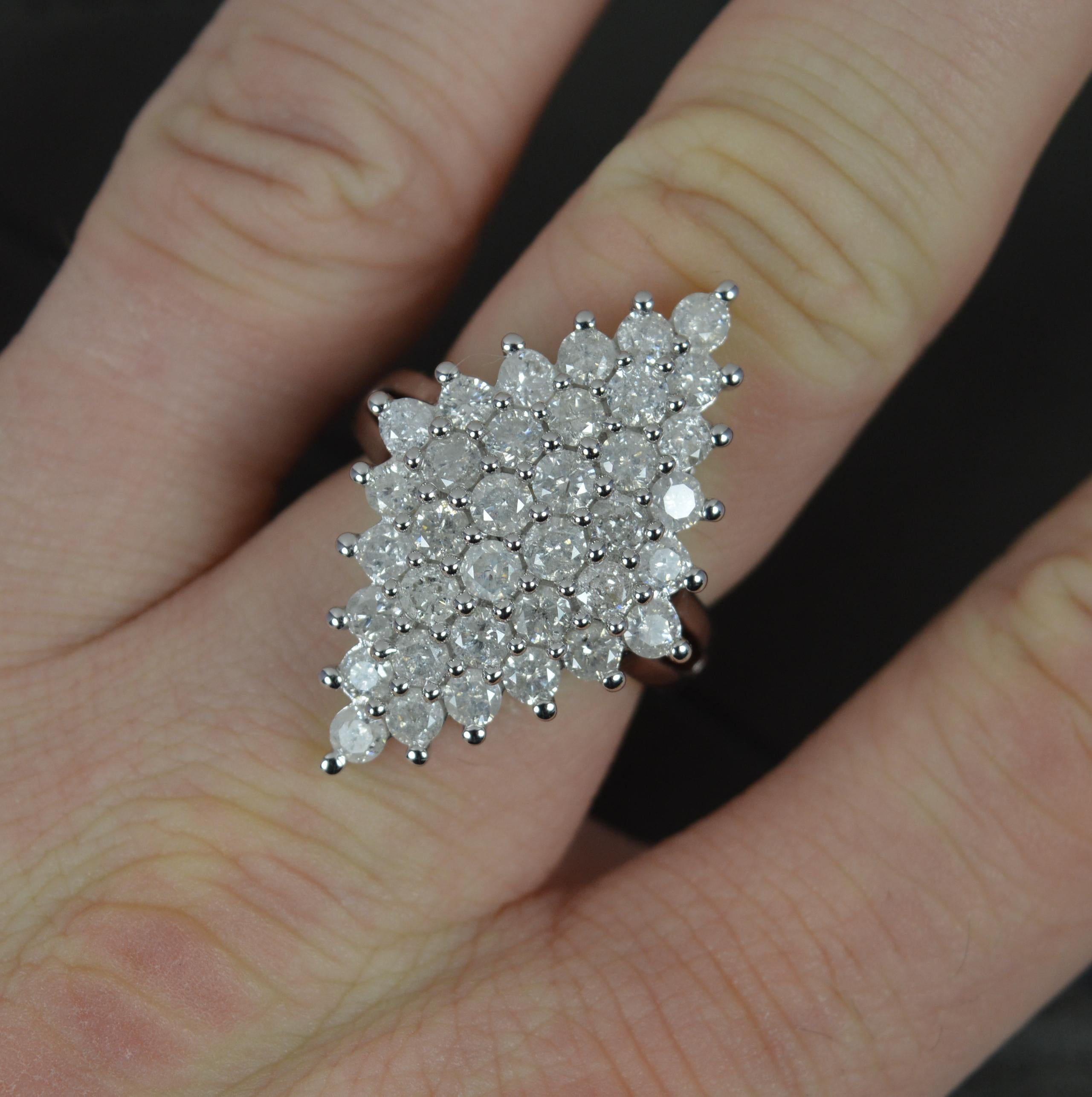 A striking 9ct Gold and Diamond cluster ring.
A vintage example in the design of a Victorian piece.
9 carat white gold example throughout.
Set with 36 natural round brilliant cut diamonds to total 3.00 carats approx.
19mm x 29mm cluster