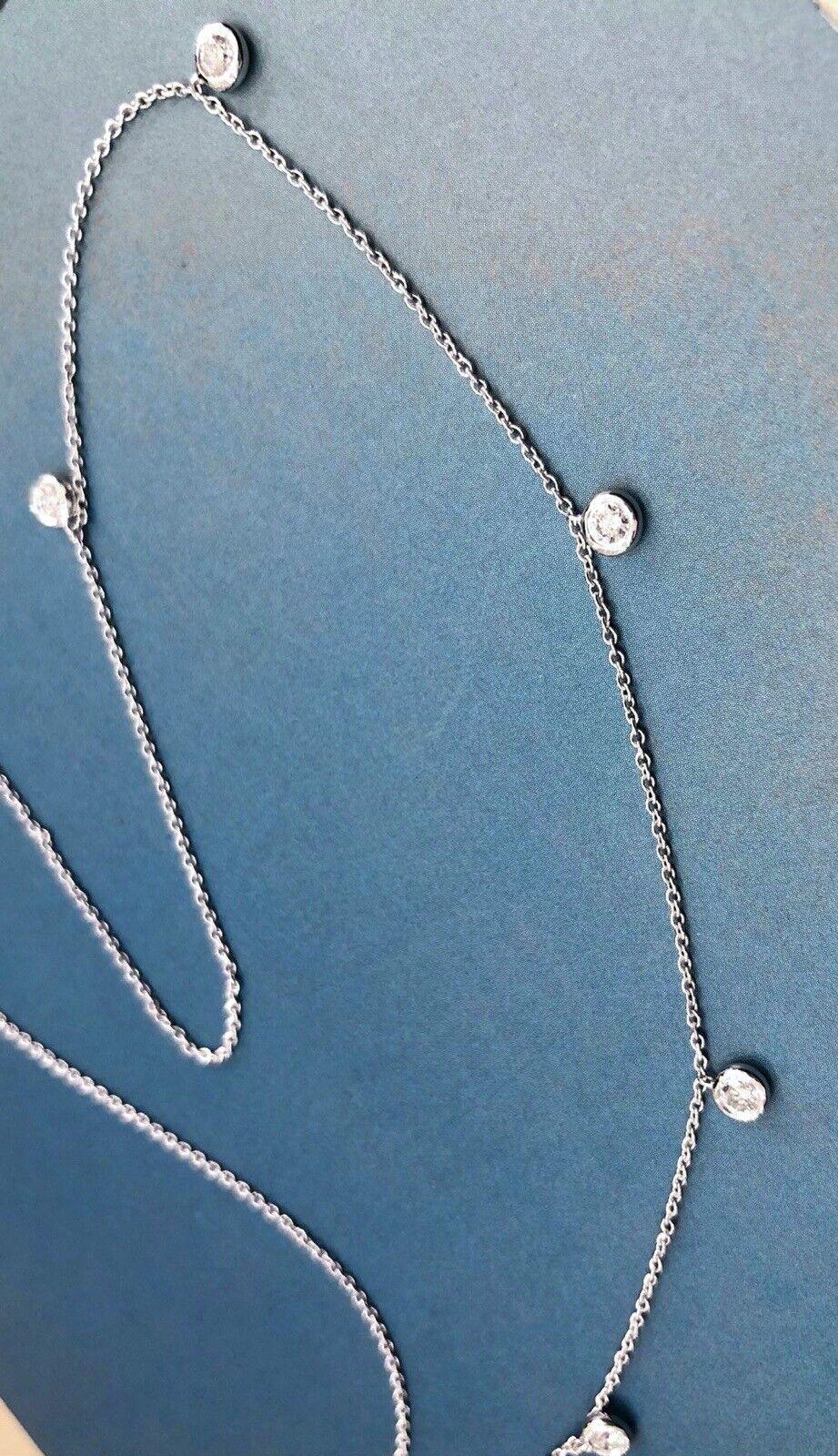 A delicate raindrop necklace with bezel set diamonds all across the necklace

Classic and dazzling

0.25ct combined weight

A gorgeous piece straight from heart of London Hatton garden at exceptional price

SI1 clarity - fiery and very sparkling.