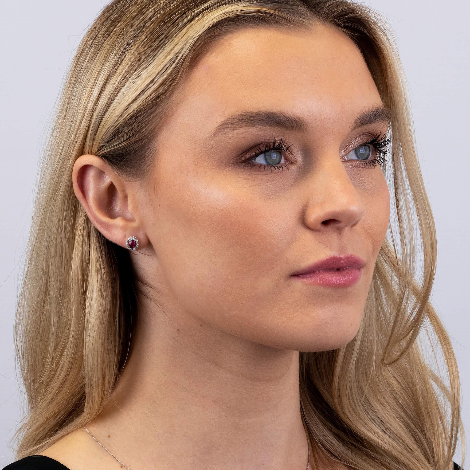 9ct White Gold Diamond & Ruby Earrings

Discover the allure of our 9ct White Gold Diamond & Ruby Earrings, perfect for adding a sophisticated touch to any ensemble. These exquisite stud earrings feature captivating oval cut rubies, elegantly framed