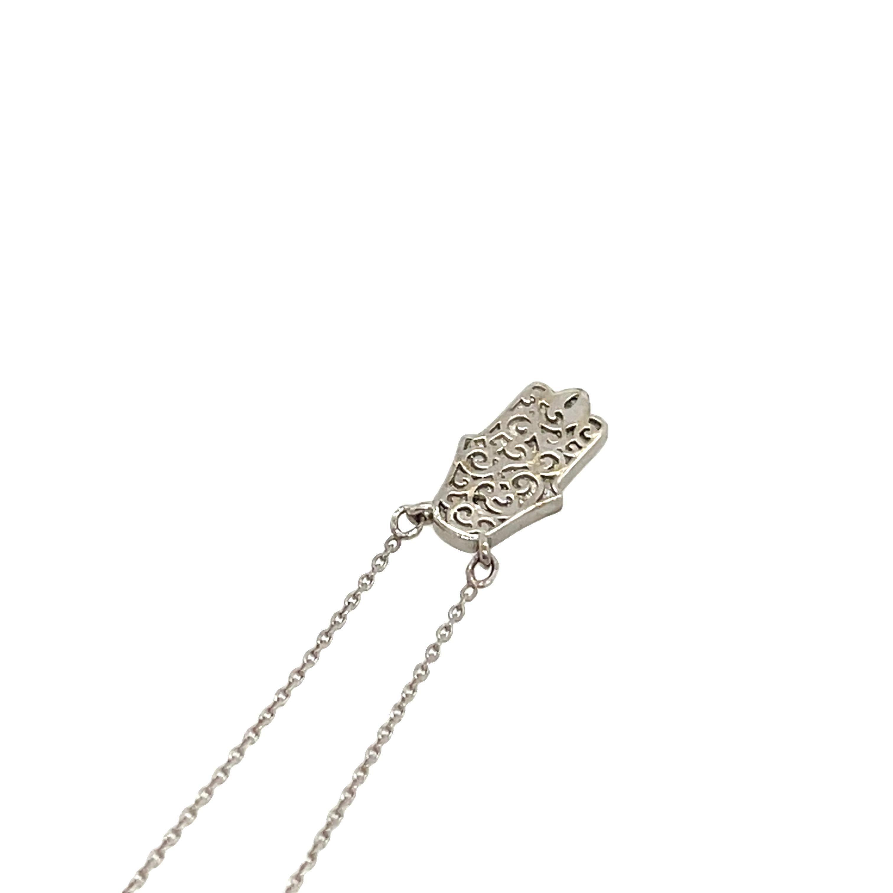 A beautifully crafted 9ct white gold Hamsa pendant necklace, set with 0.15ct of natural diamonds for a subtle yet radiant sparkle. The Hamsa, a symbol of protection, luck, and blessings, makes this necklace both meaningful and stylish.


Total