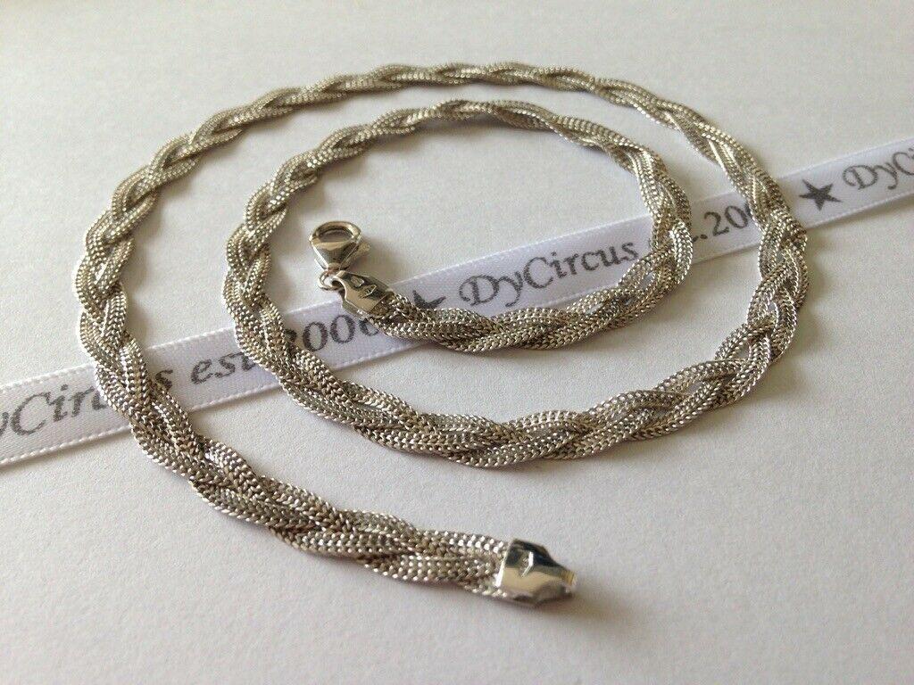 9ct White Gold 
Beautiful Trio Strand 
woven design necklace 
Weight and very noticeable.
Full British Hallmarks 